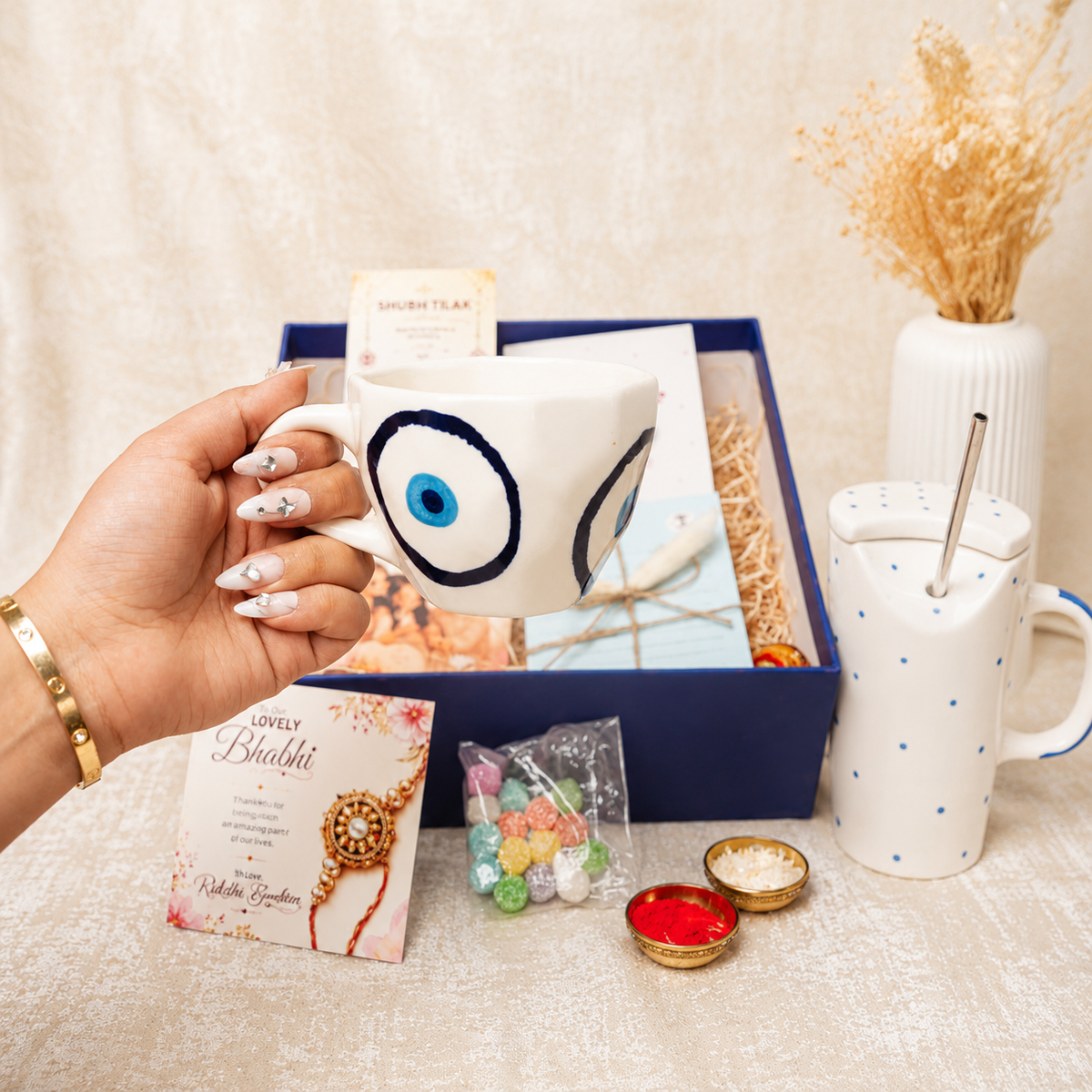Artecasa Nazar Se Surakshit Rakhi Hamper | Evil Eye Rakhi Gift for Brother & Bhabhi - https://artecasa.in/