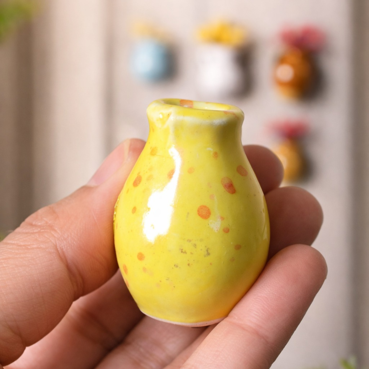 Colorful ceramic fridge magnets with dried florals