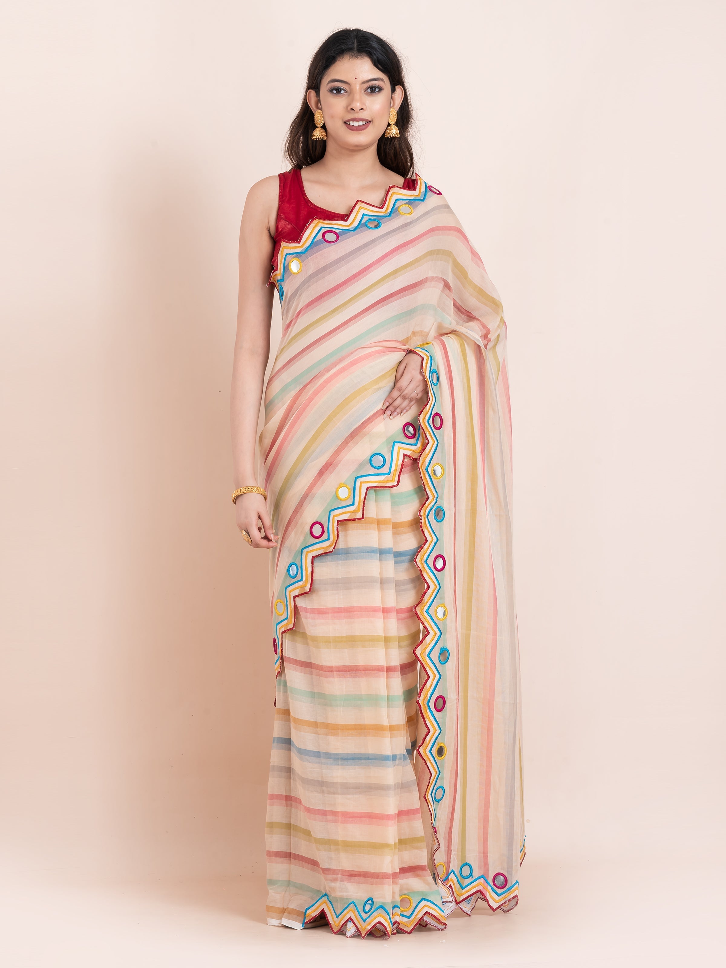 Lightweight peach mulmul cotton saree by Shopaame with mirror embroidery and multicolored stripes. Perfect for festive looks and effortless elegance.