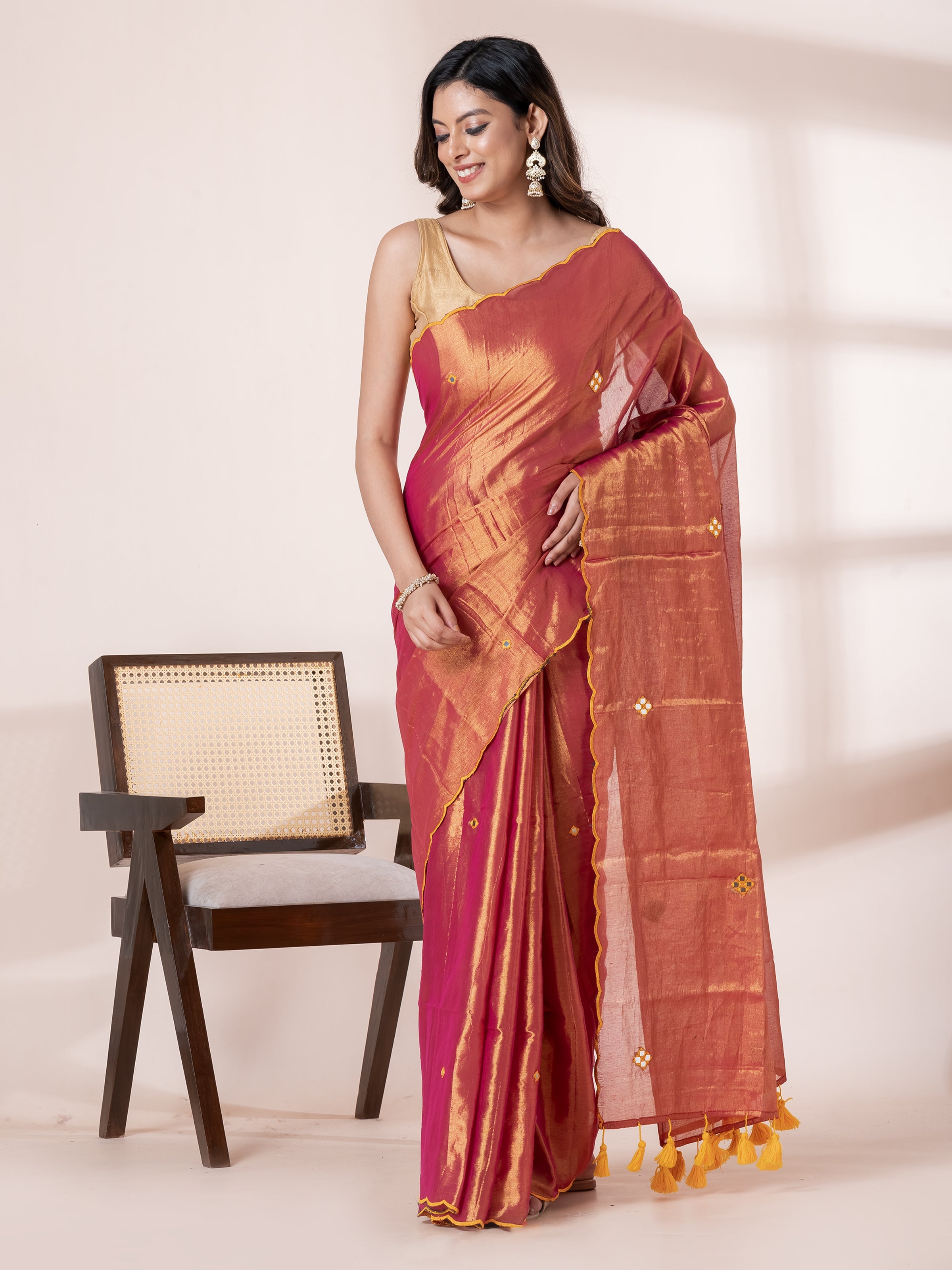 Golden festive saree with soft tissue fabric and elegant ethnic appeal