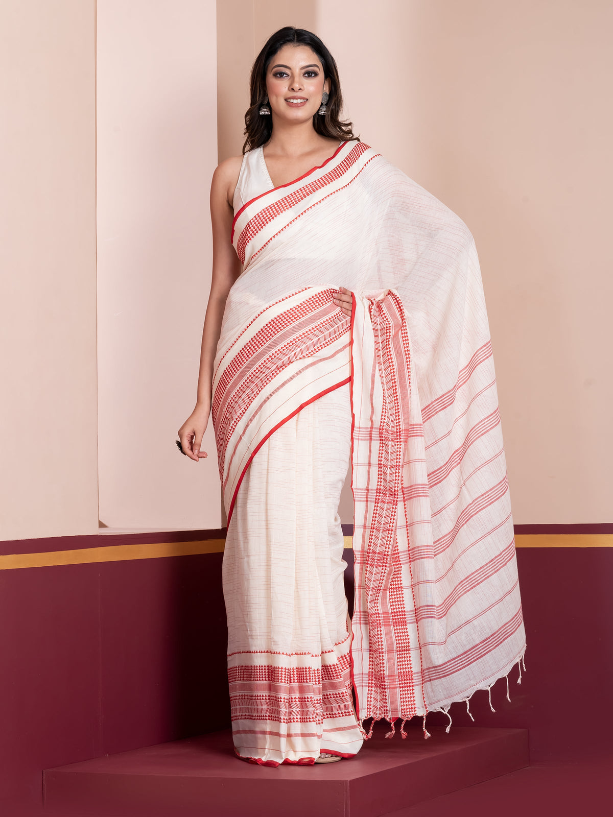 Nakshaghar white red saree crafted with traditional Bengali festive elegance