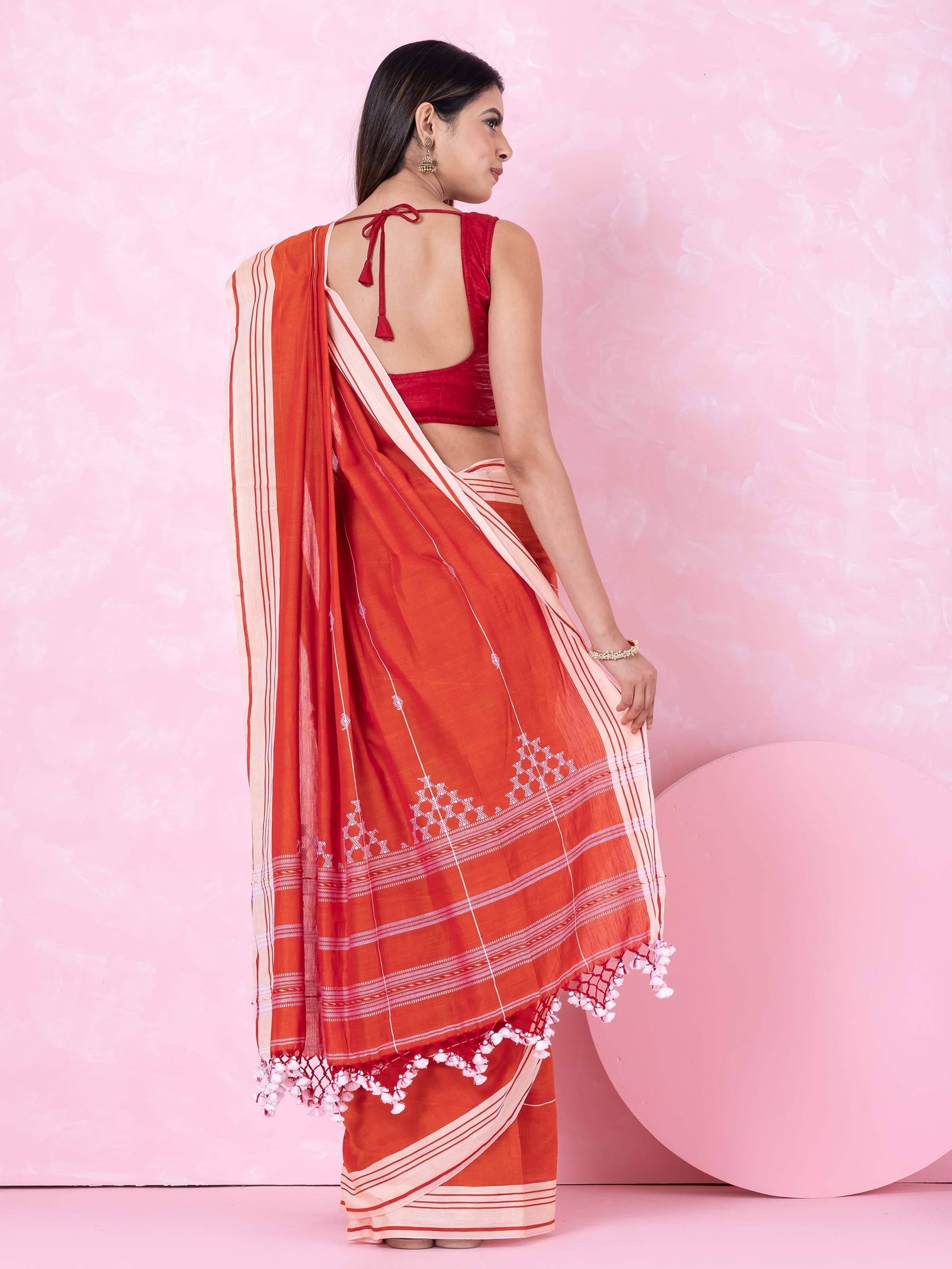 Rustic Reverie: orange- white handloom cotton saree by Shopaame