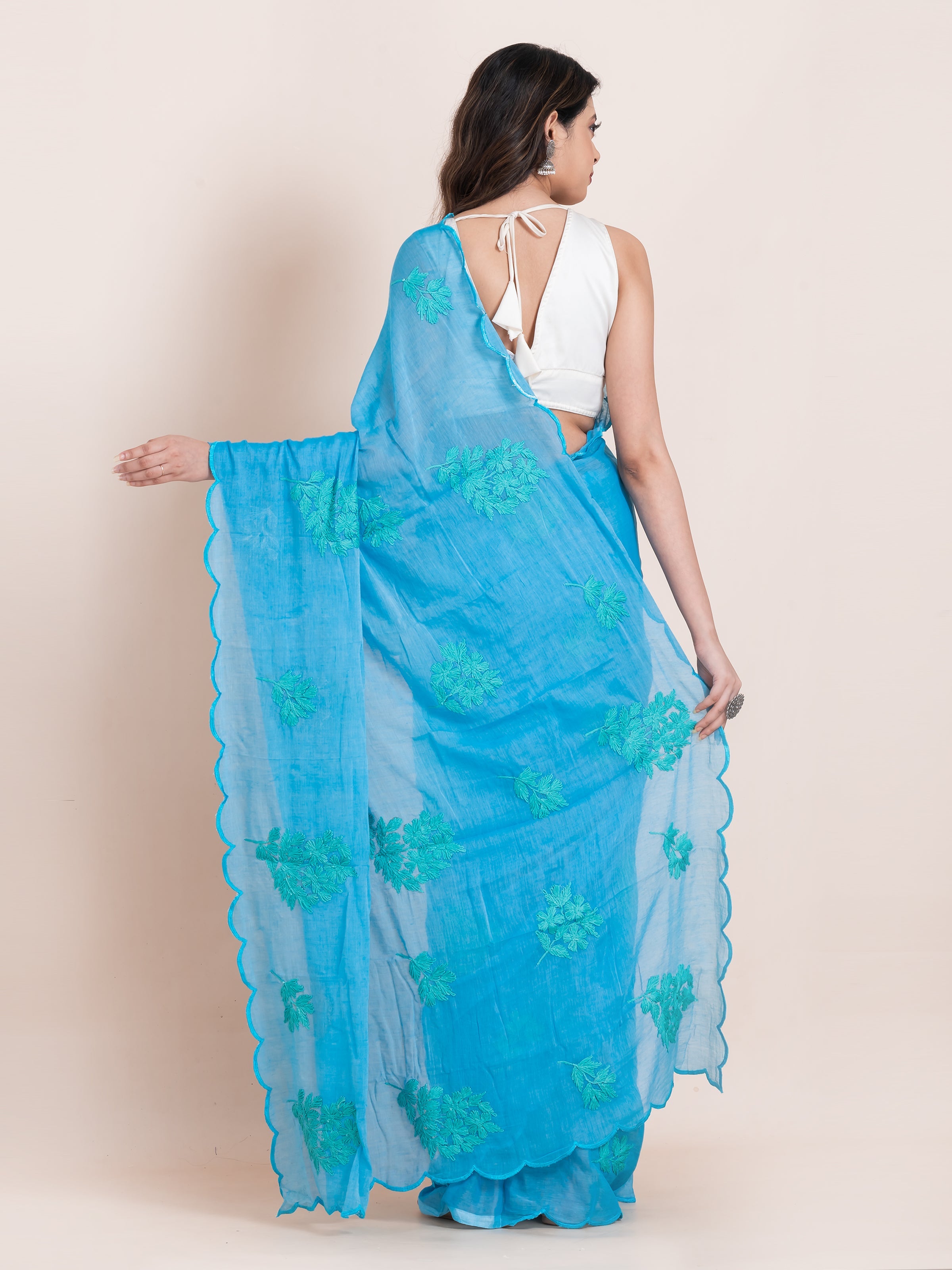 Firoza blue cotton saree, handcrafted with delicate chikankari work for a breathable and graceful look.