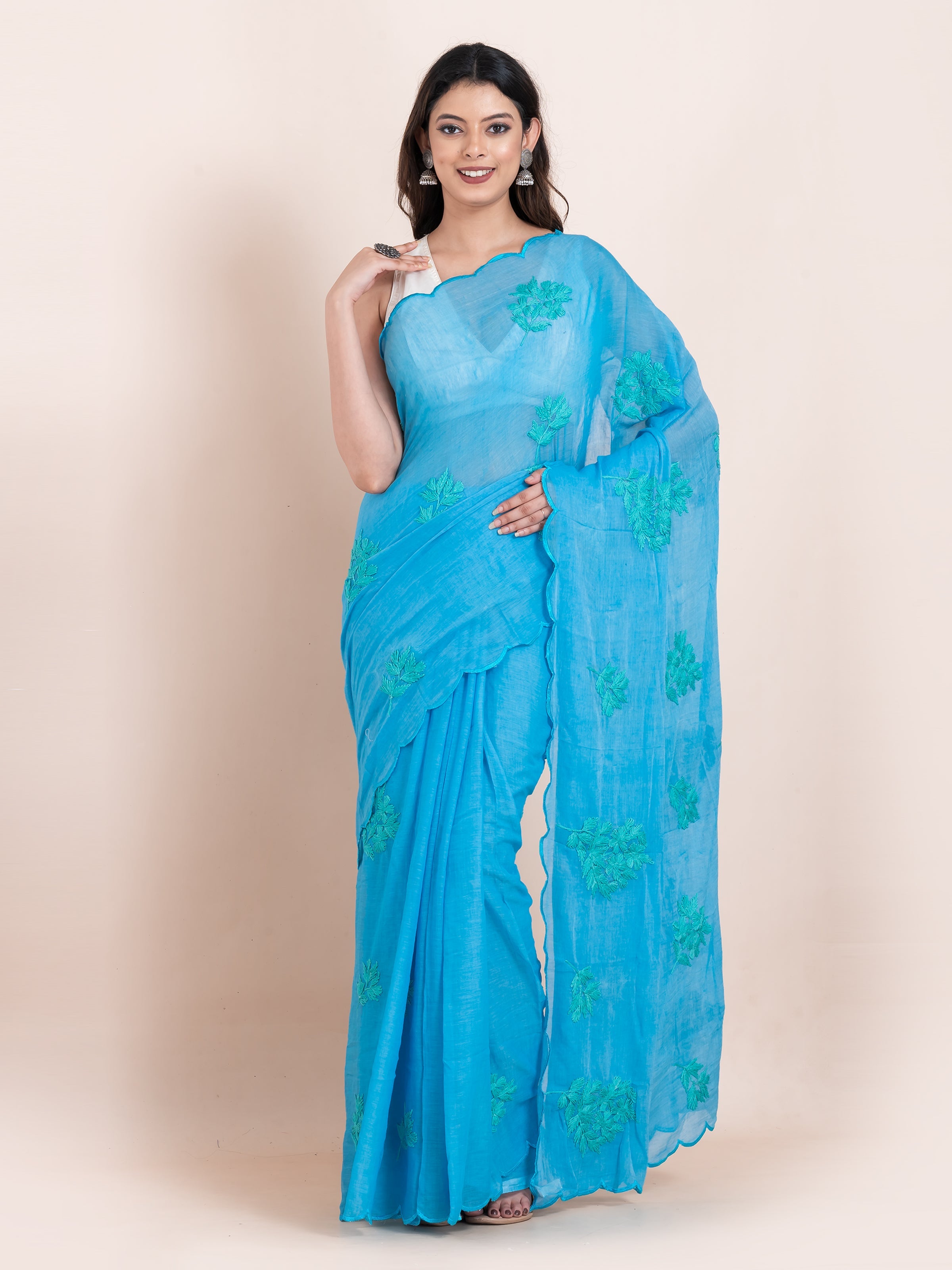 Lightweight blue chikankari embroidered mulmul cotton saree, designed for festive wear with soft comfort.