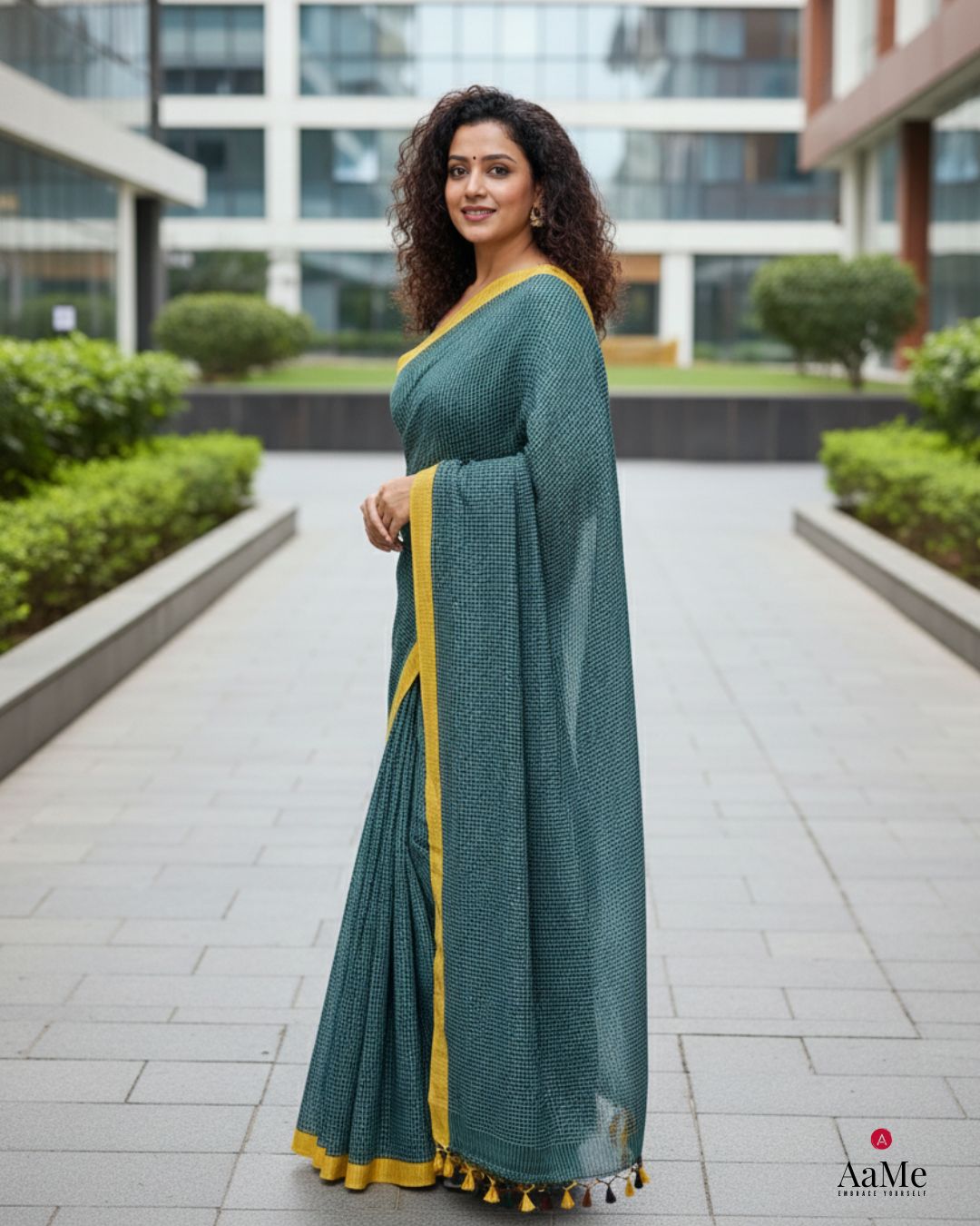 Woman wearing Neerja handloom cotton green saree by Shopaame perfect for a professional office look
