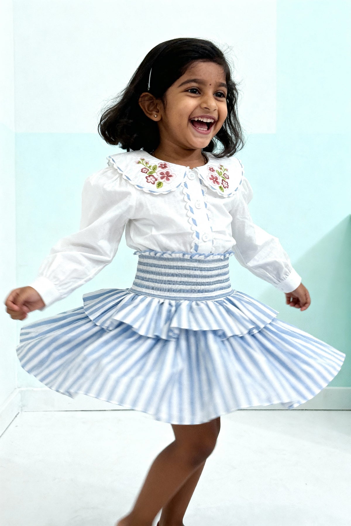 Capri Blouse and Amalfi Skort set styled on child showing coordinated outfit fit