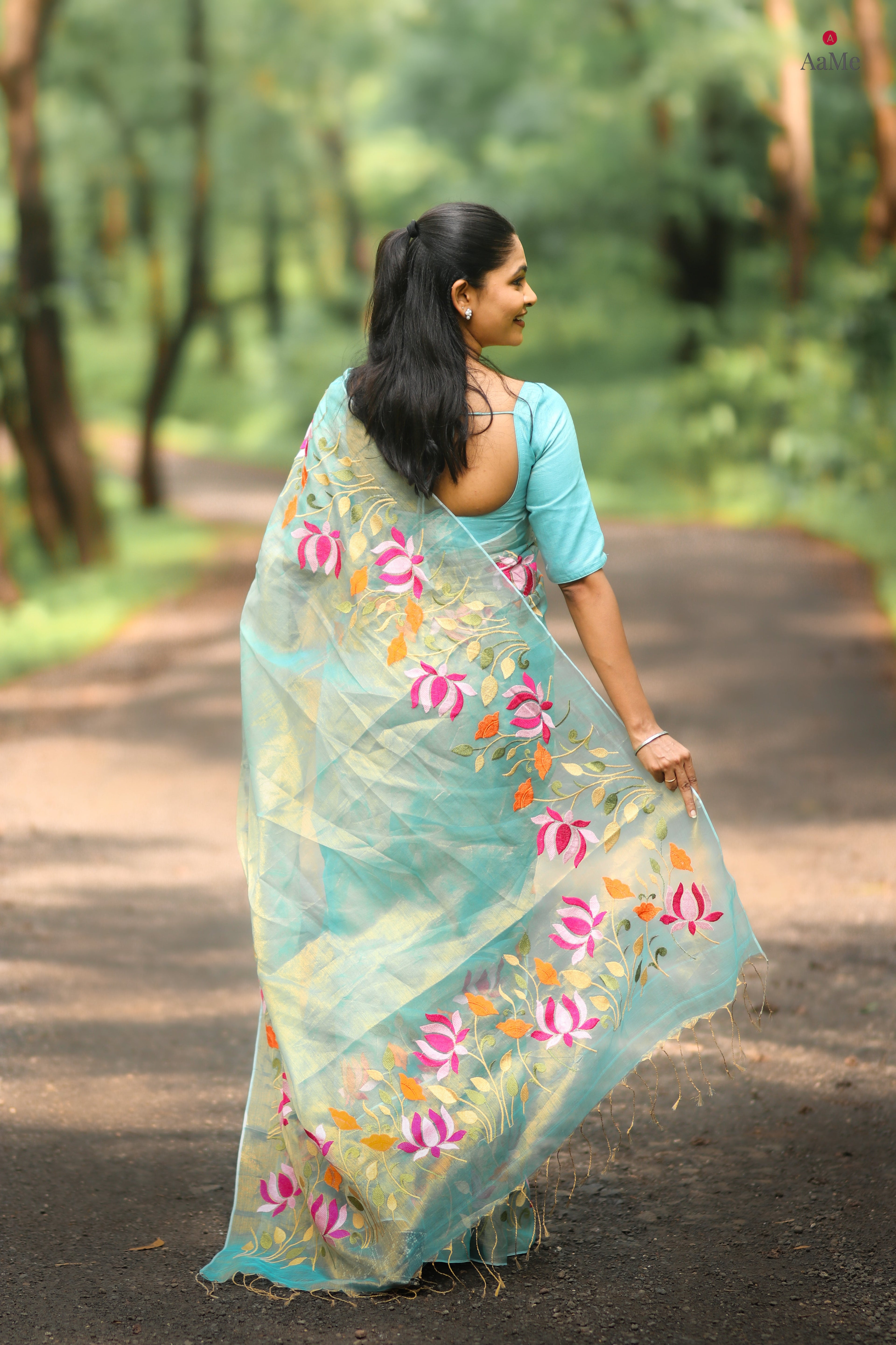 Blue viral tissue saree with floral embroidery orange and pink