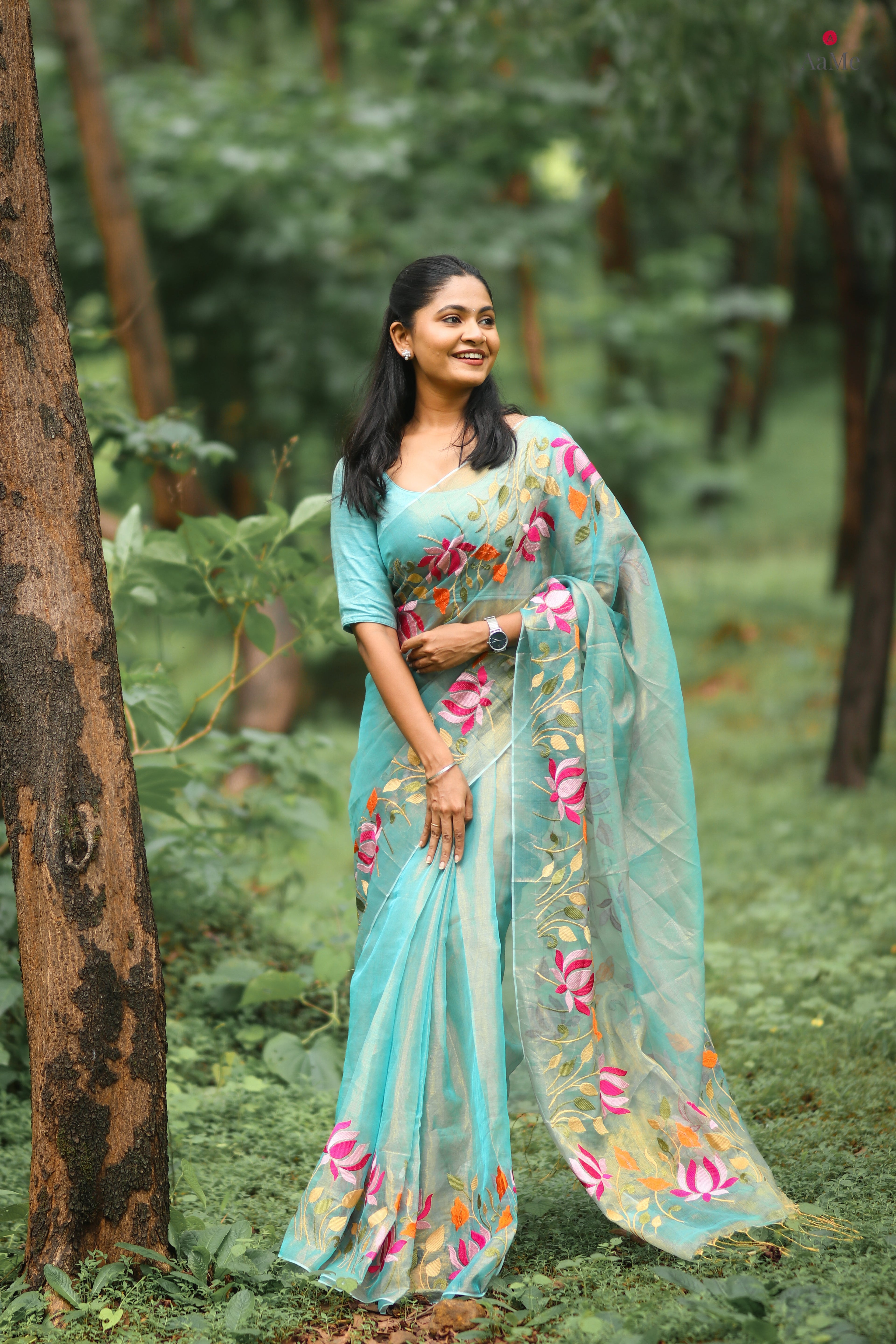 Blossom Veil tissue saree featuring a soft luminous blue drape for occasions