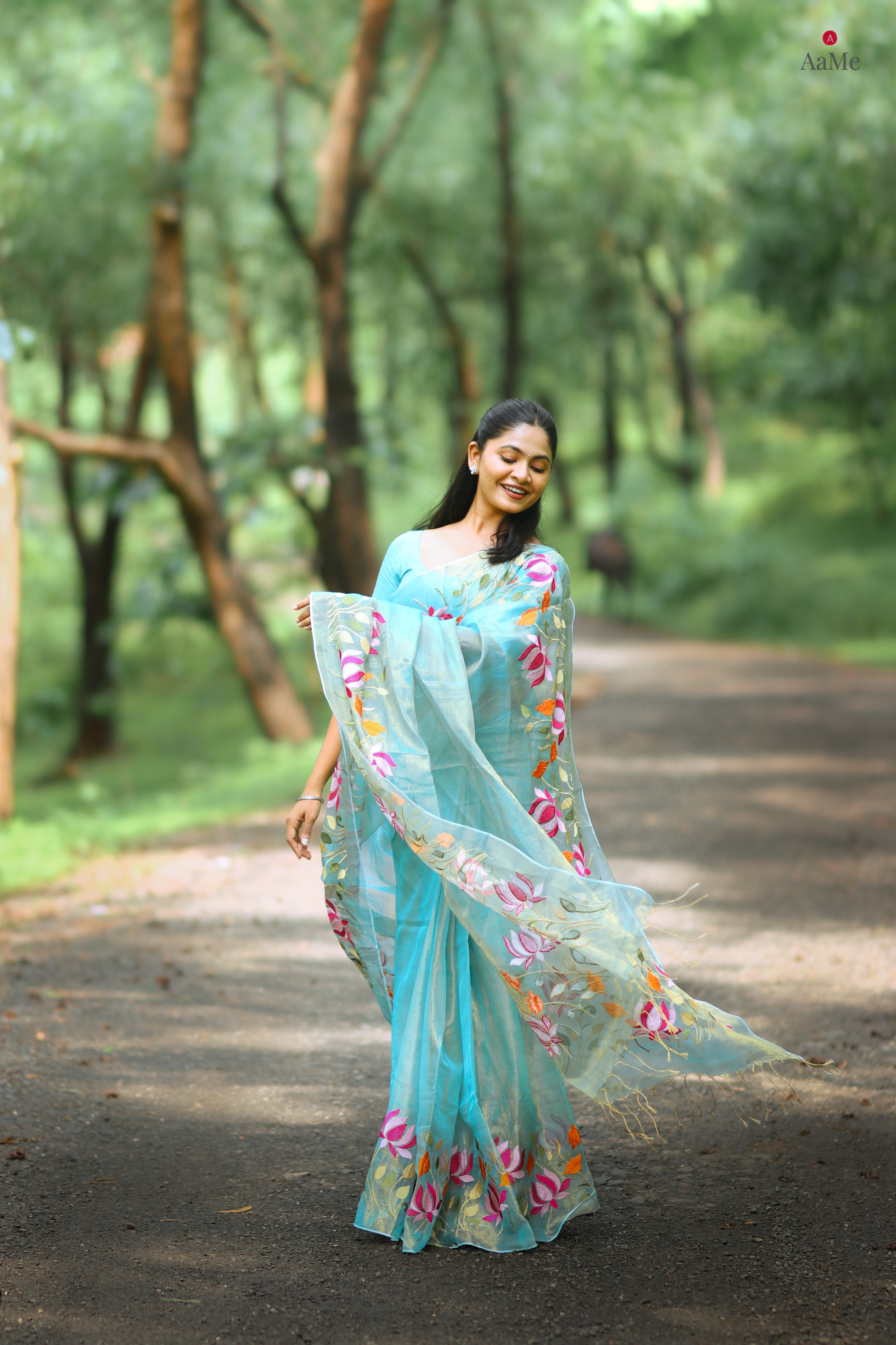 Blue viral tissue saree with floral embroidery orange and pink