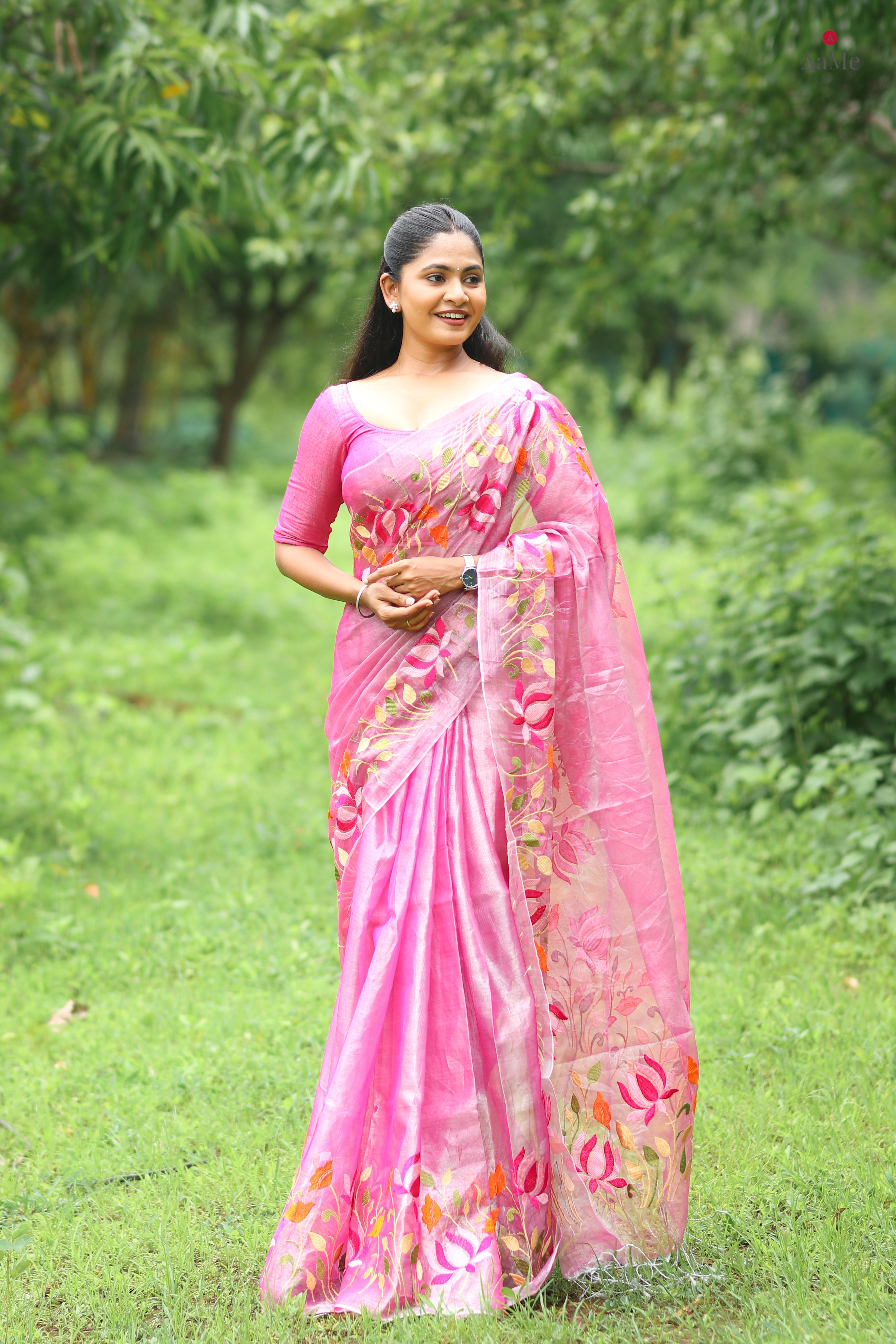 Pink tissue saree with lightweight festive drape by Shop AaMe