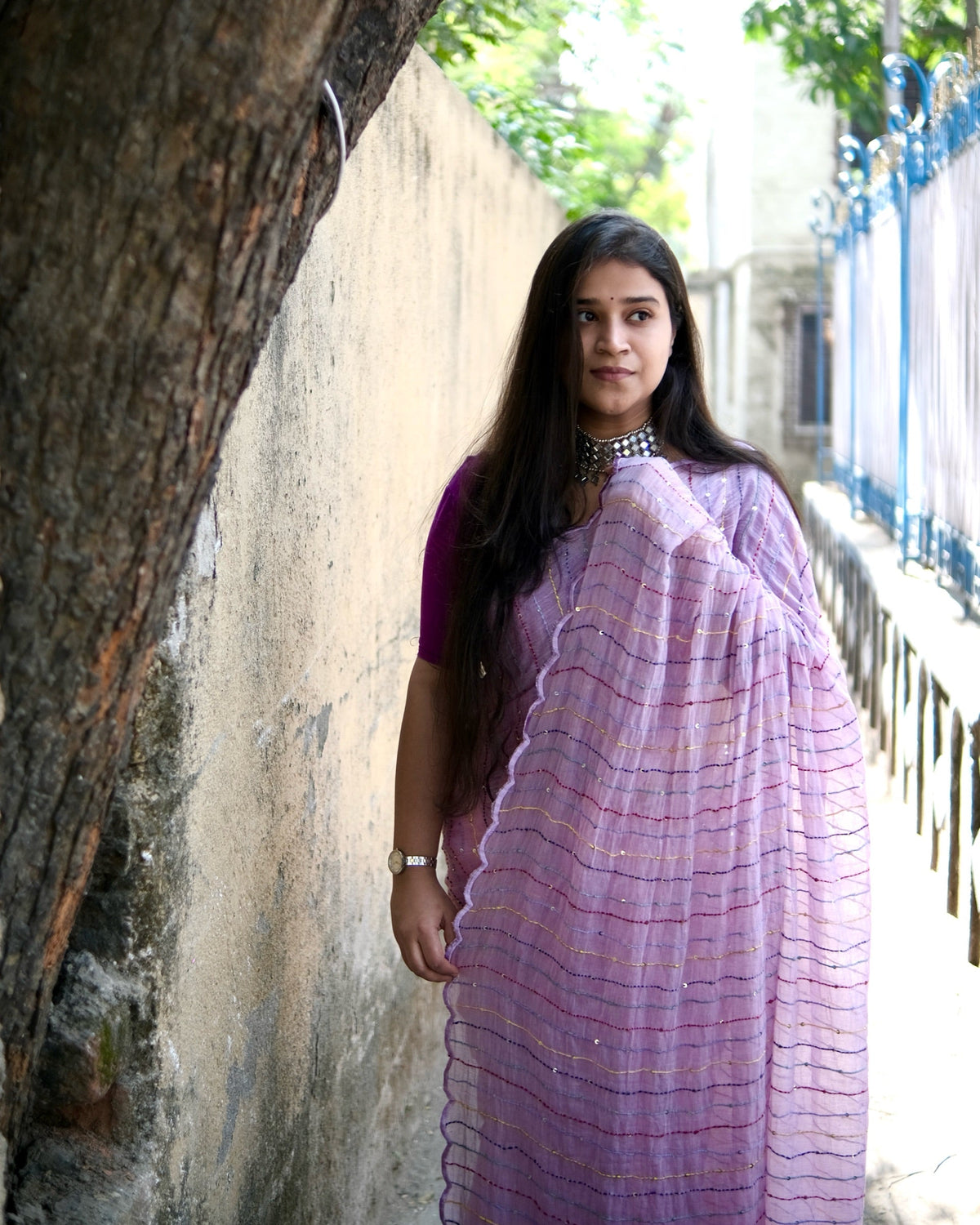 Soft and comfortable mulmul cotton saree with multicoloured embroidery in Kantha Stitch embellished with sequins perfect for party or festive occasion in purple or violet or mauve or lavender