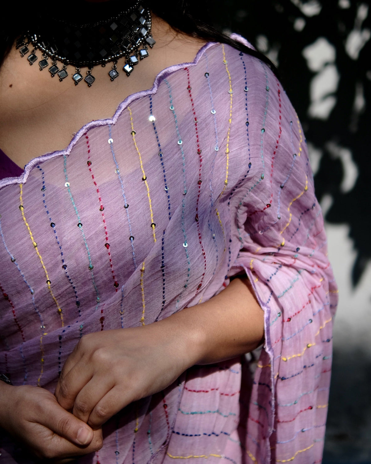Sequins embroidered purple cotton saree featuring elegant festive appeal