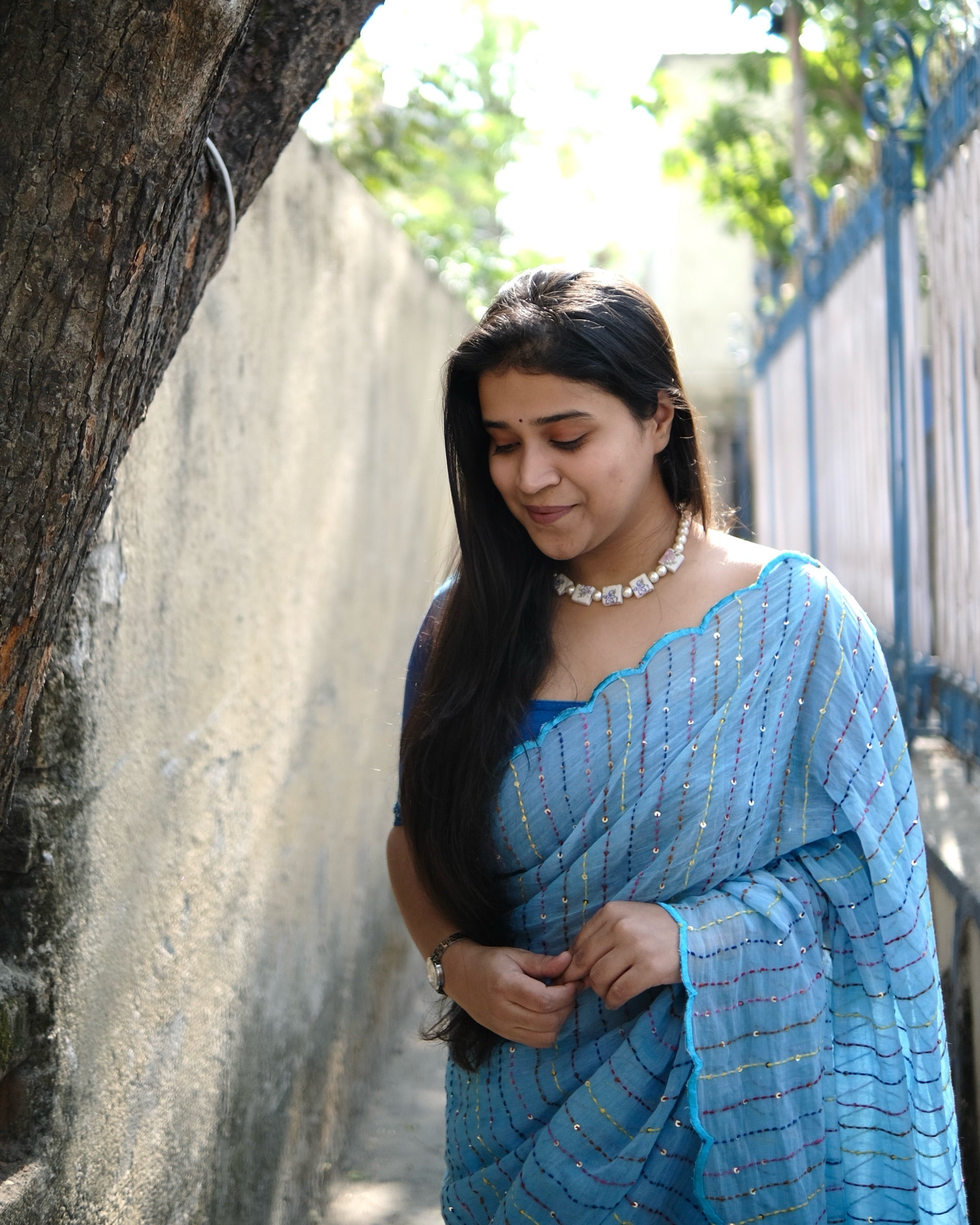 Rainbow Rain blue embroidered mulmul cotton saree with multicolour sequins, a lightweight breathable saree for summer and festive wear.
