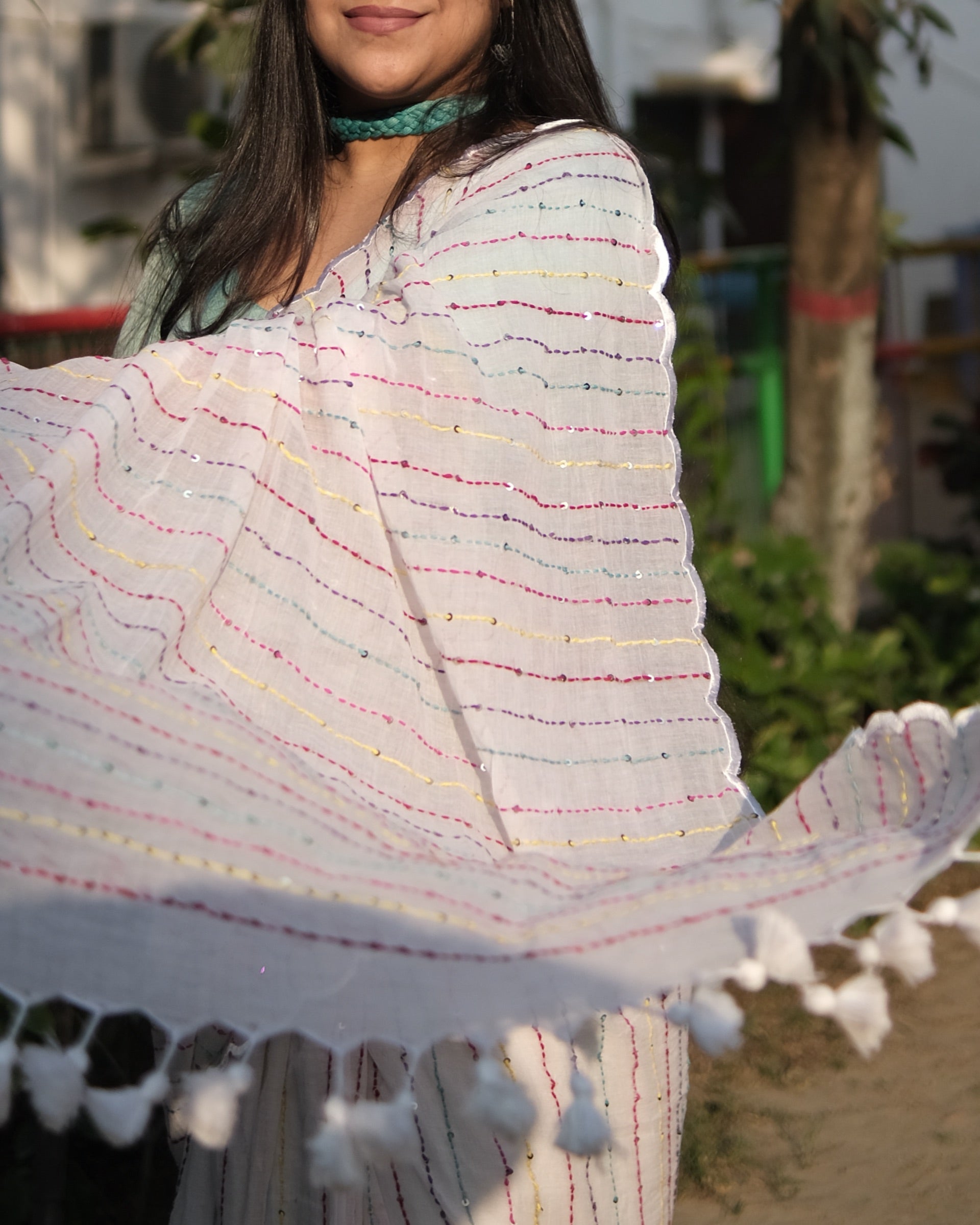 Designer white mulmul cotton saree with embroidery for festive wear and day styling