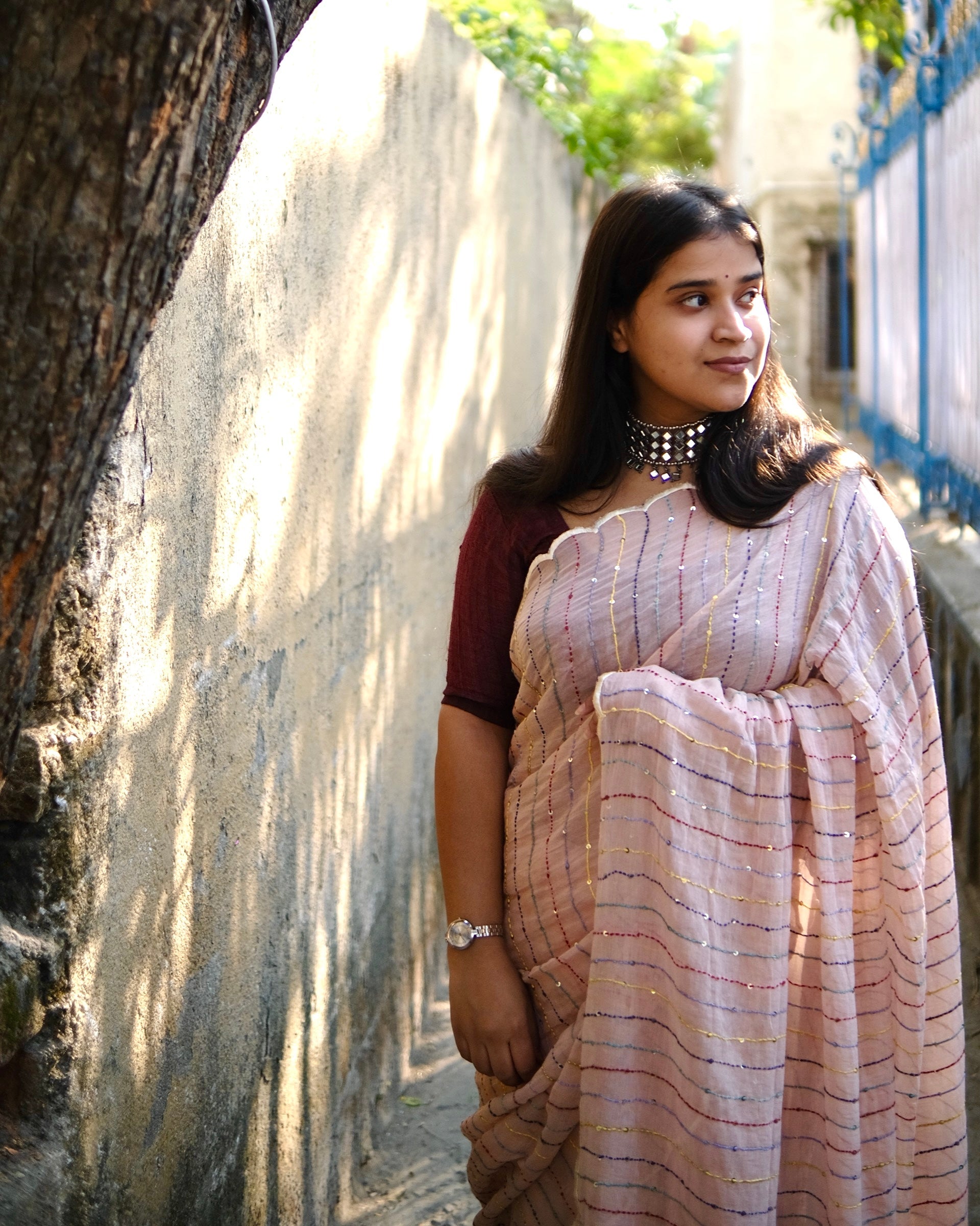Lightweight ivory embroidered mulmul cotton saree, designed for soft comfort and effortless summer elegance.