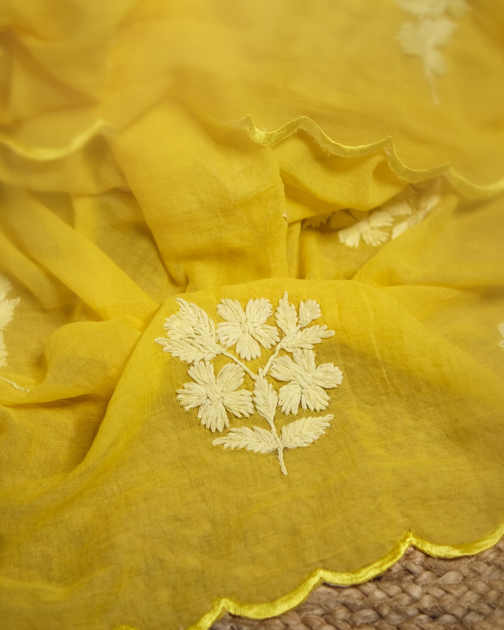 Yellow mulmul cotton saree with chikankari embroidery, soft airy elegance for summer styling and festive moments.