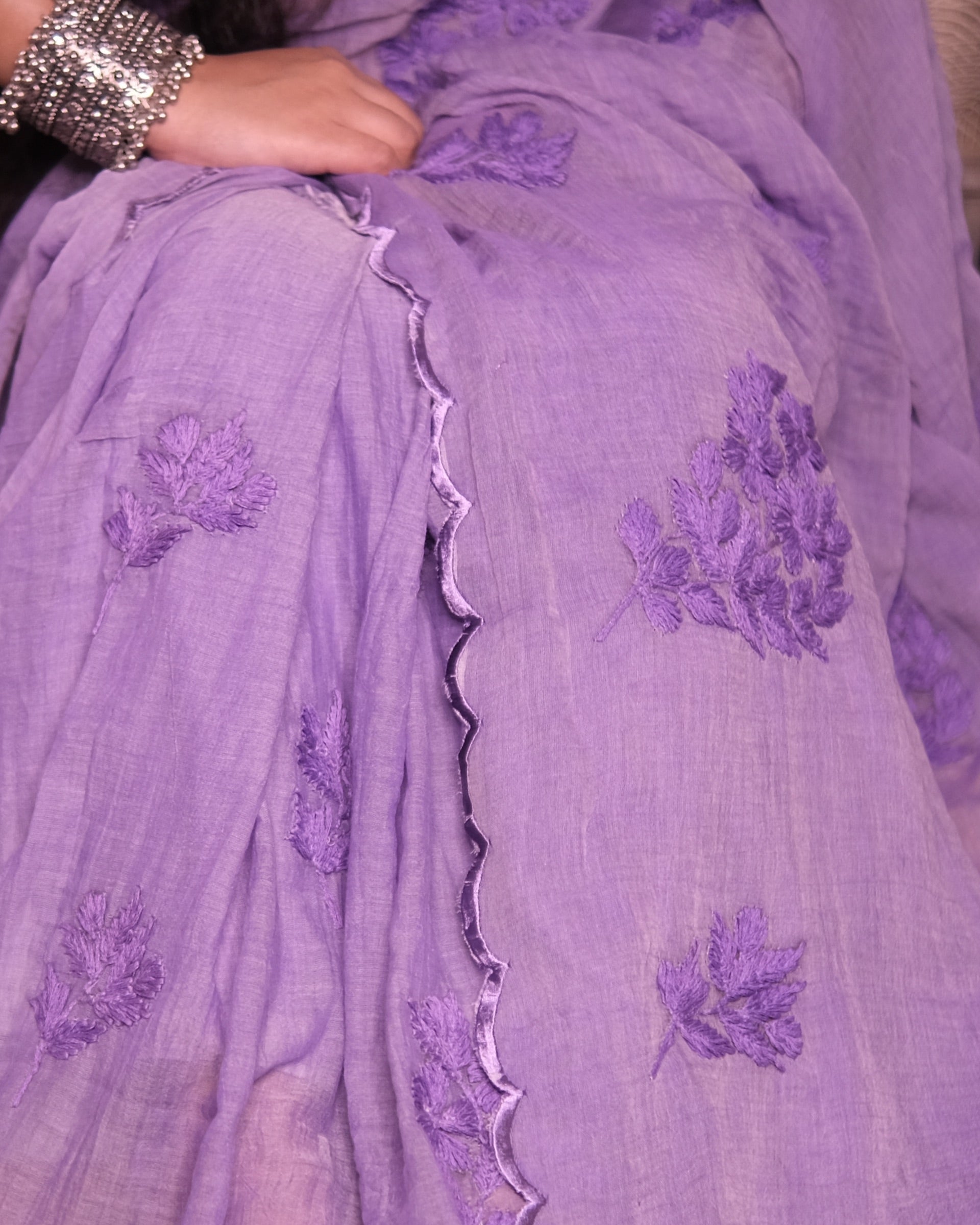Purple mulmul cotton saree with traditional chikankari embroidery, a breathable saree for elegant summer days.