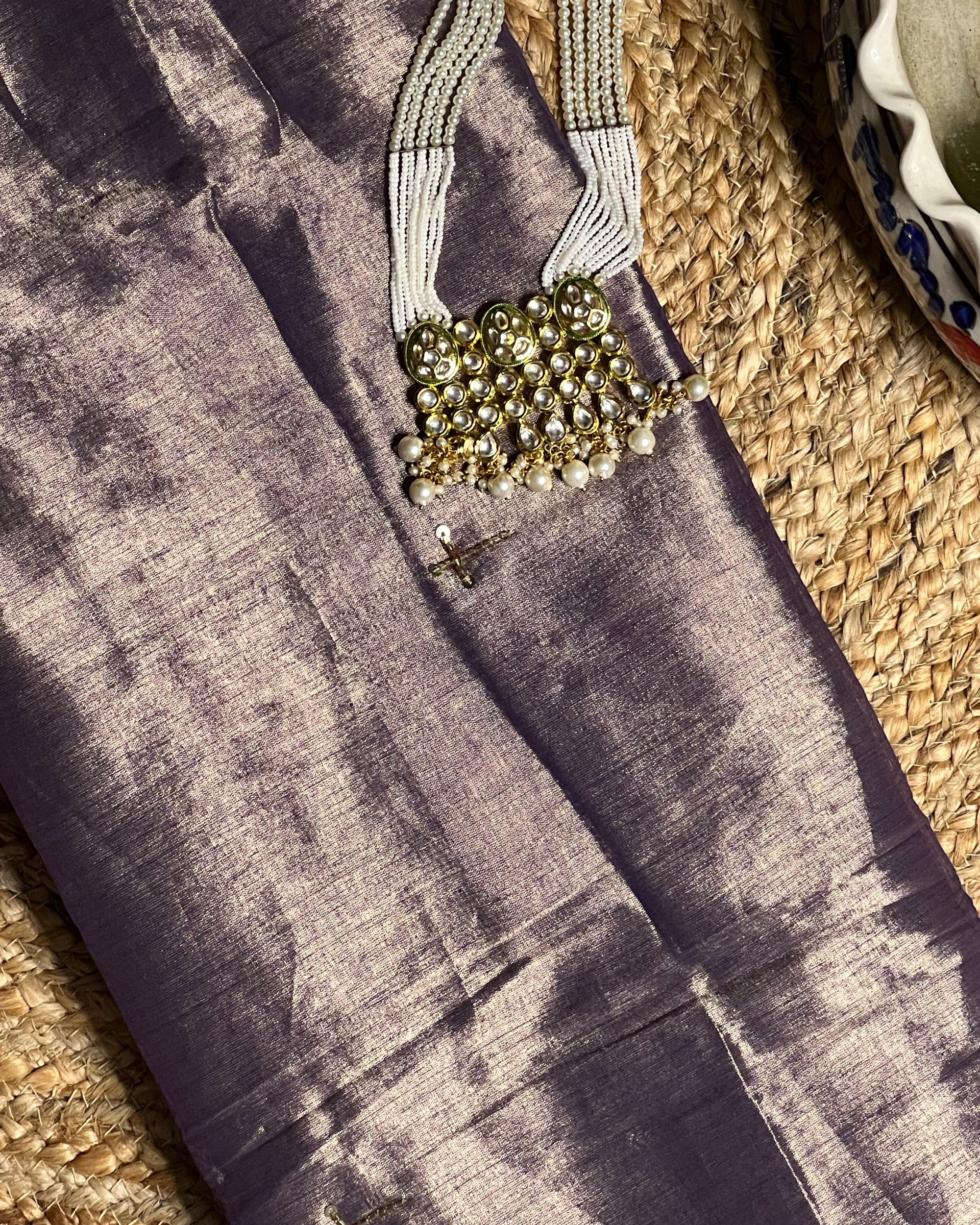 Mulmul Tissue Festive/Party Wear saree for the wedding season in lavender / purple / violet colour with red Sari border and Zardozi/Jarsousi work on entire saree, metallic finish