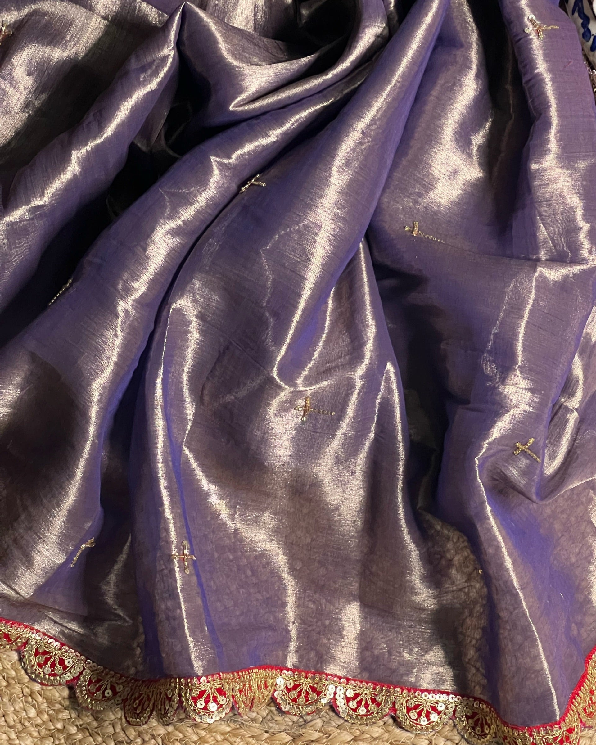 Mulmul Tissue Festive/Party Wear saree for the wedding season in lavender / purple / violet colour with red Sari border and Zardozi/Jarsousi work on entire saree, metallic finish