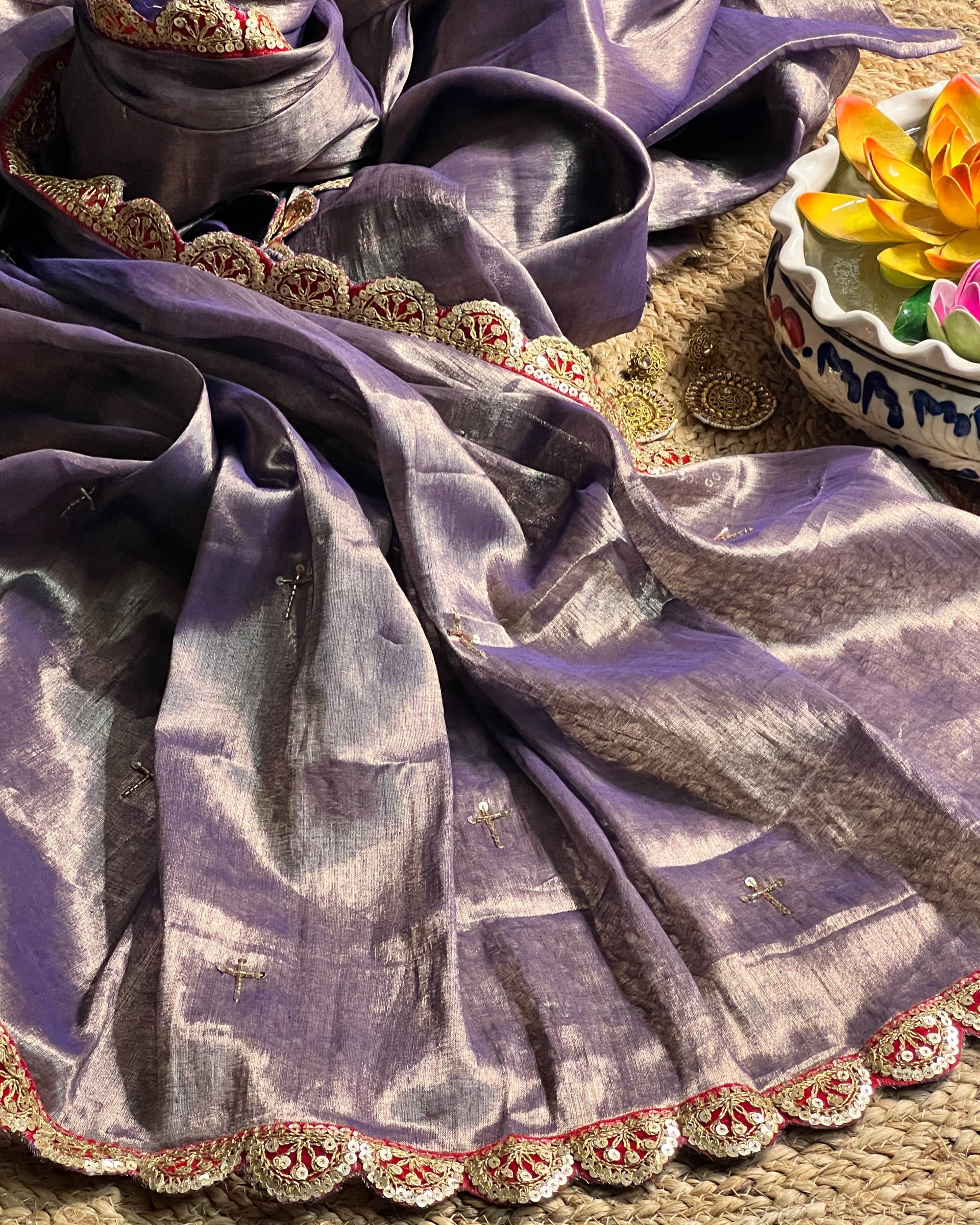 Mulmul Tissue Festive/Party Wear saree for the wedding season in lavender / purple / violet colour with red Sari border and Zardozi/Jarsousi work on entire saree, metallic finish