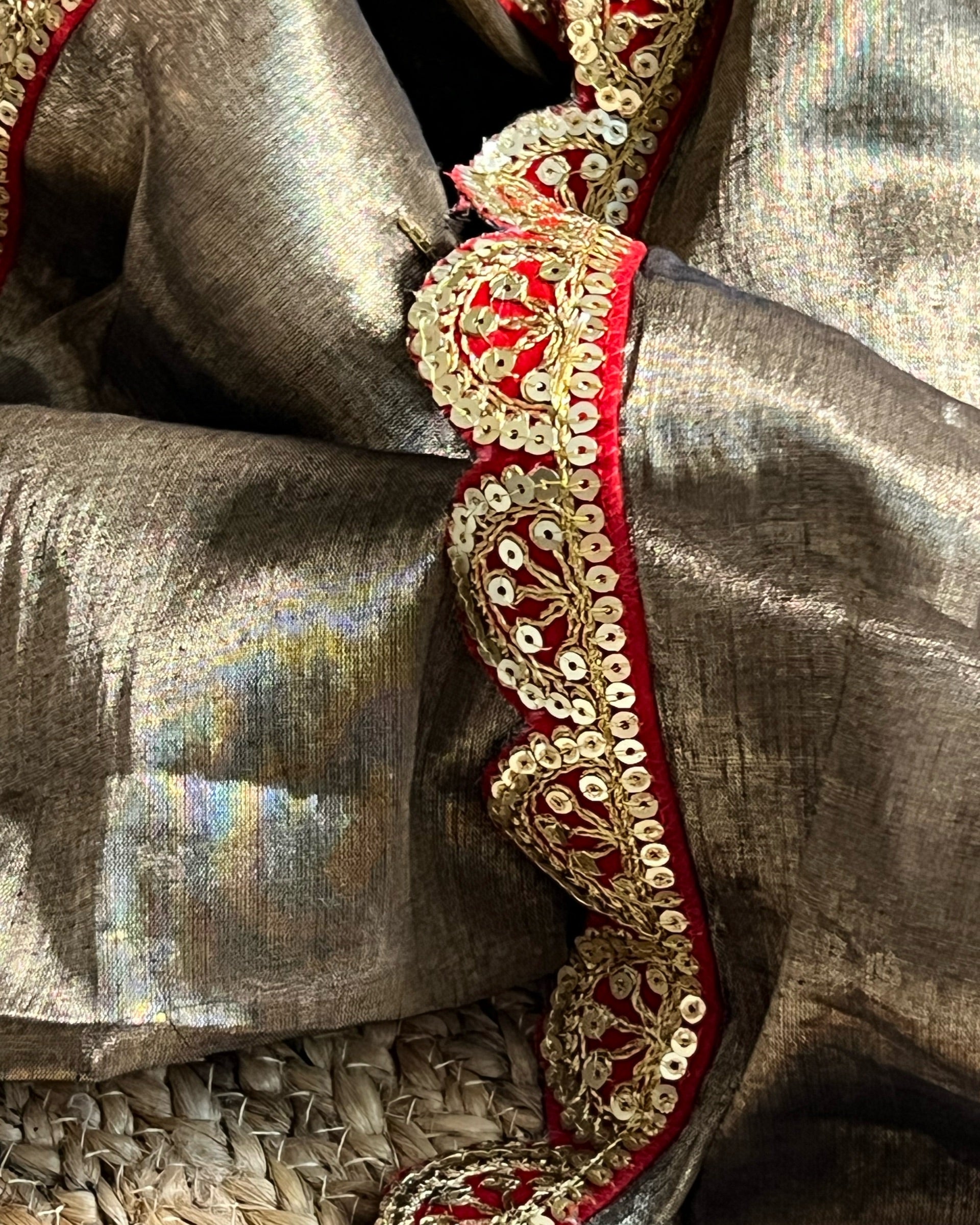 Mulmul Tissue Festive/Party Wear saree for the wedding season in dark liquid gold colour with red Sari border and Zardozi/Jarsousi work on entire saree, metallic finish