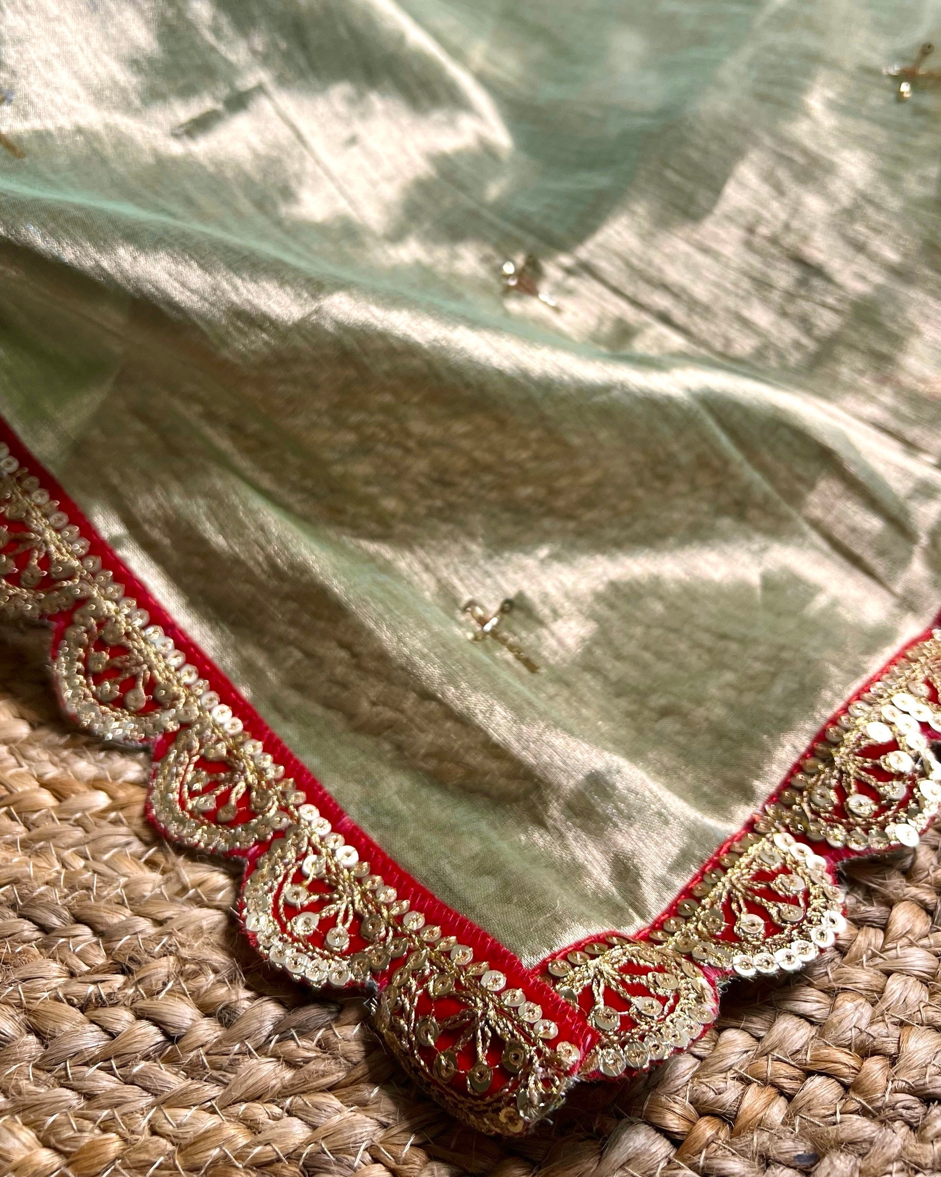 Mulmul Tissue Festive/Party Wear saree for the wedding season in green with red Sari border and Zardozi/Jarsousi work on entire saree, metallic finish