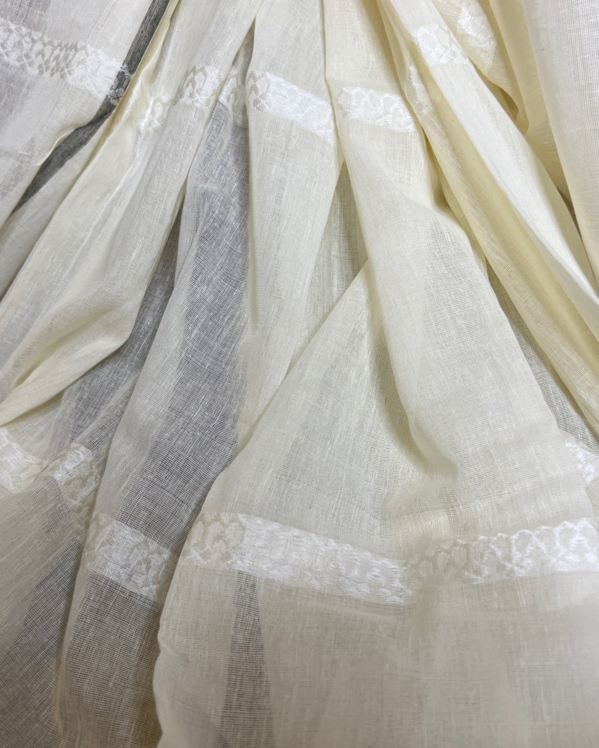 Soft white khadi cotton saree by Shopaame with black and red Ganga Jamuna border