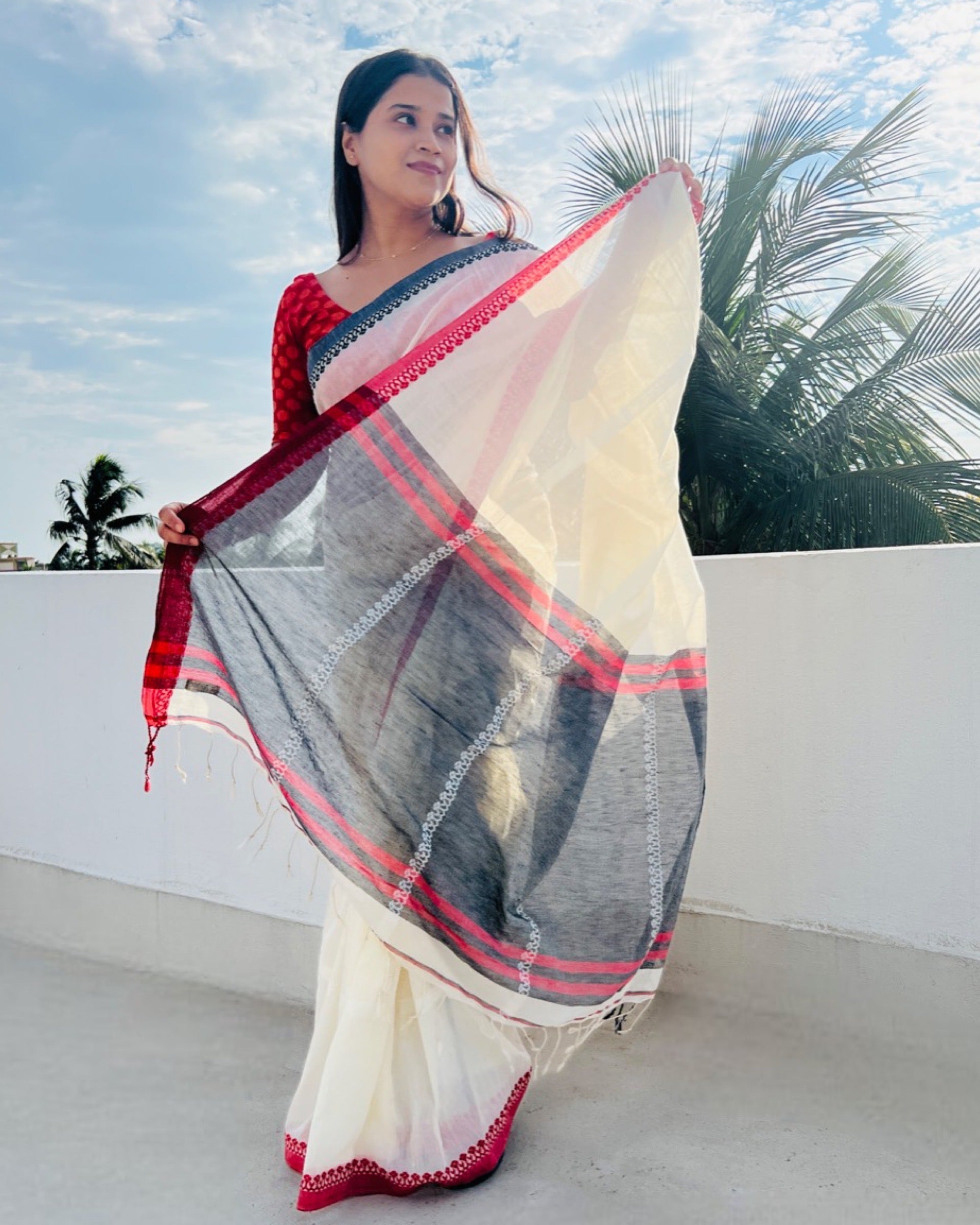 Soft and comfortable white khadi cotton saree with black and red Ganga Jamuna border by Shopaame