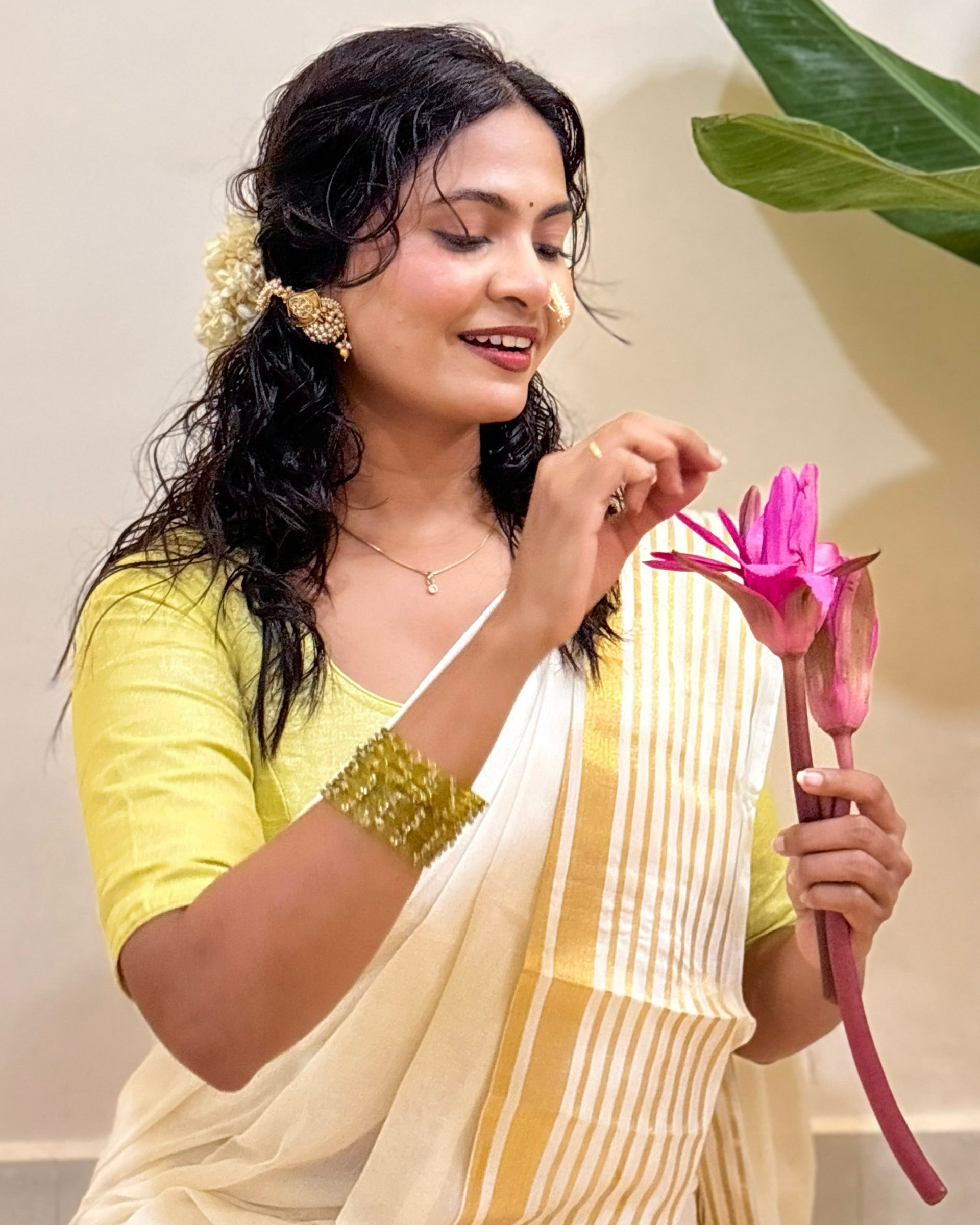 Designer Onam white mulmul cotton saree with traditional Kasavu charm and soft drape