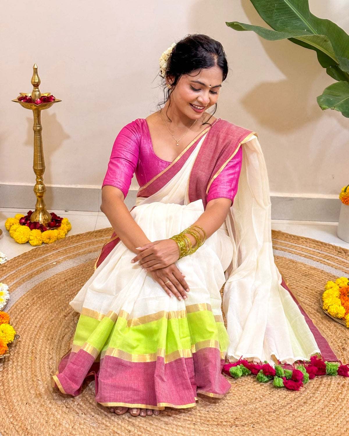 Onapookal white mulmul cotton saree crafted with breathable fabric and elegant festive comfort