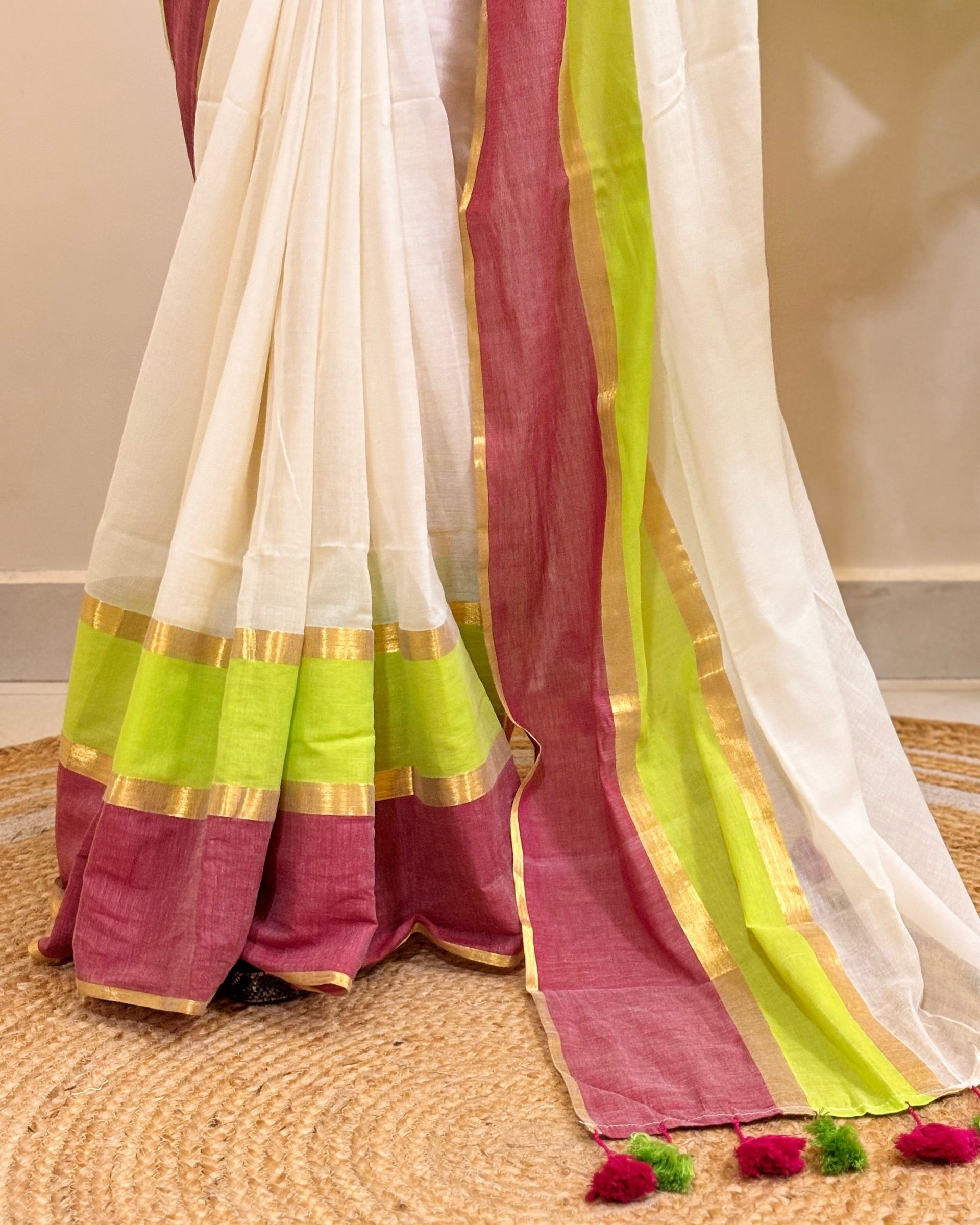 Traditional white mulmul cotton saree for Onam celebrations and ethnic styling