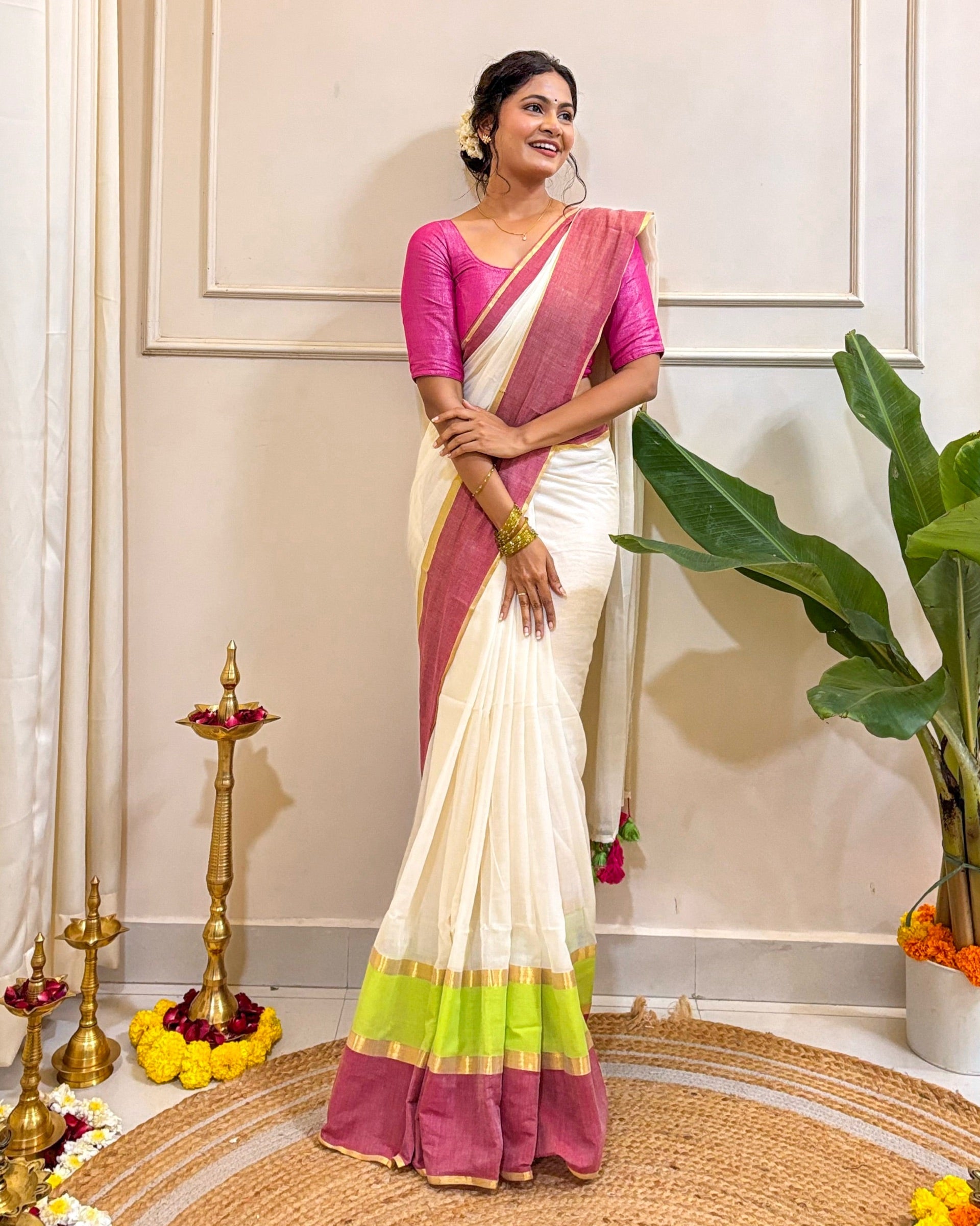 White Onam mulmul cotton saree with soft drape and graceful festive appeal
