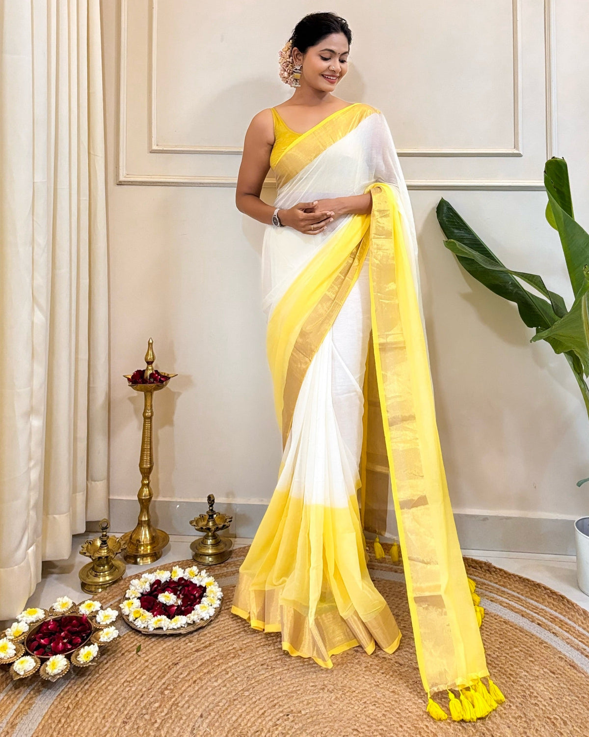 Designer white mulmul cotton saree with gold border and yellow festive accents