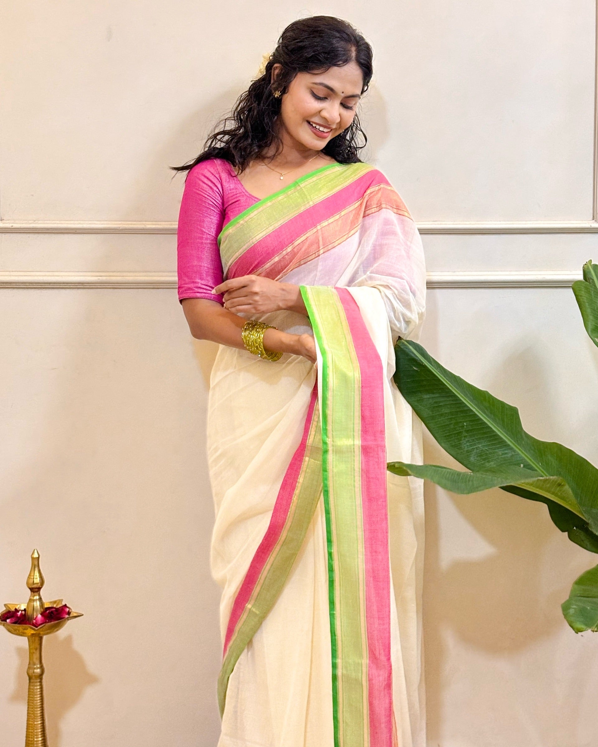 Ponnonam Pookal white mulmul cotton saree crafted with feather-light festive drape