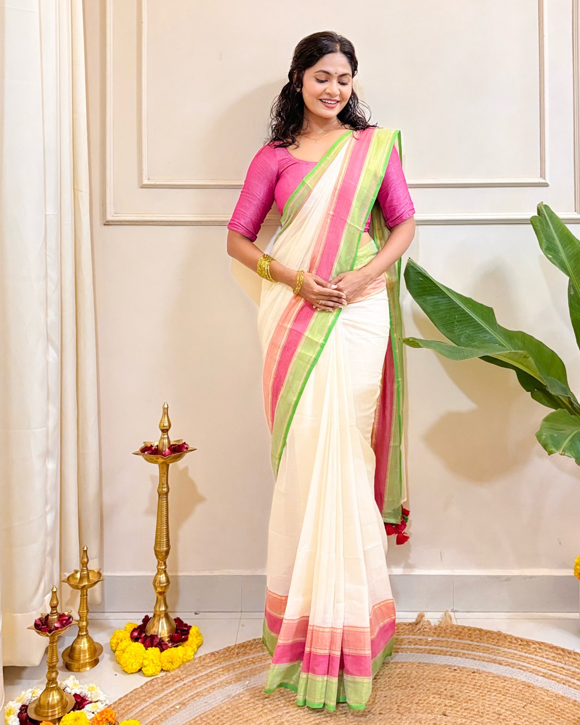 Designer Onam white mulmul cotton saree with soft drape and traditional ethnic charm