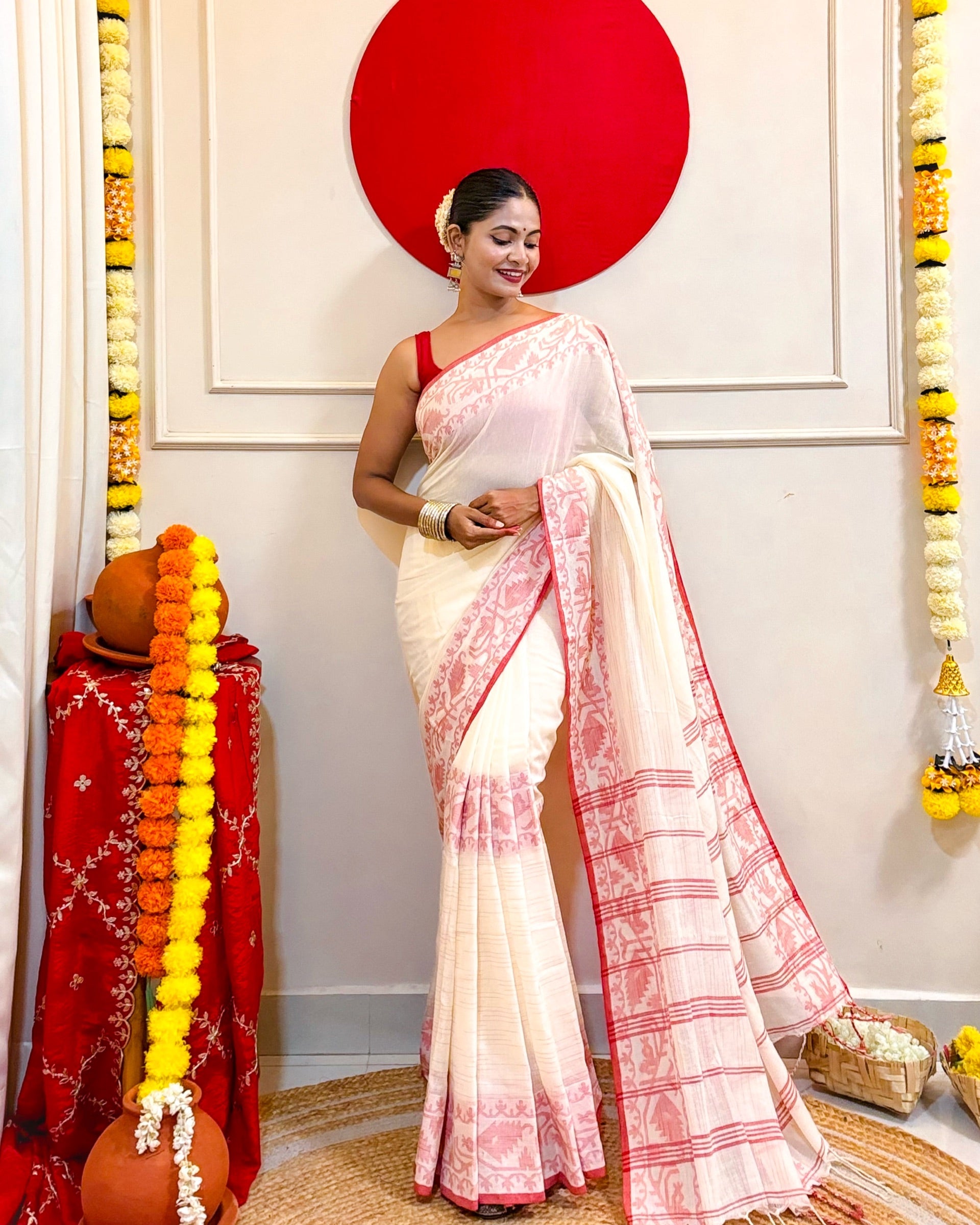 Laal Paar Sada khadi cotton saree featuring graceful festive drape for Durga Puja