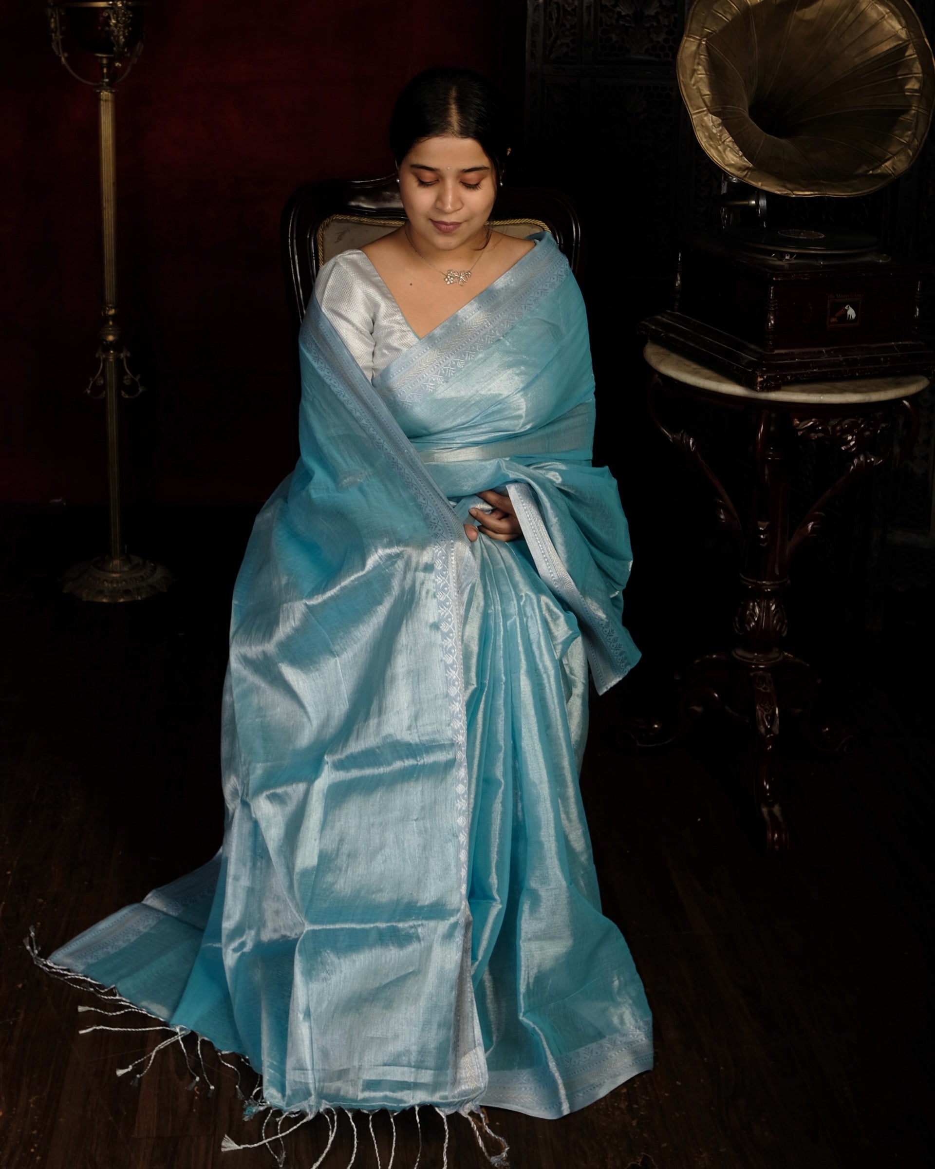 Blue mulmul cotton tissue saree with lightweight festive drape and silver border