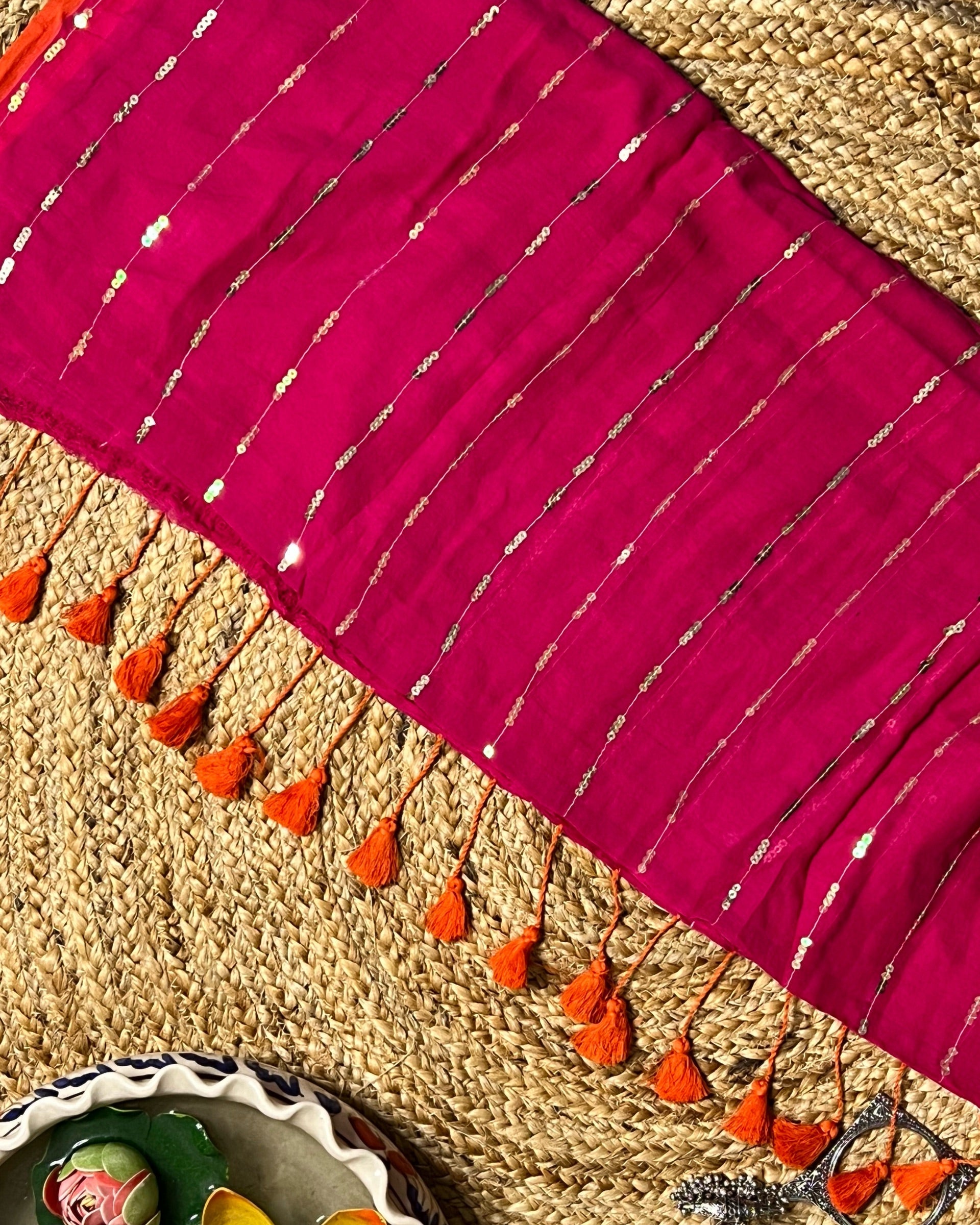 Soft and Comfortable mulmul cotton saree in pink rani shade with sequin emblishment for festive or party wear at reasonable price