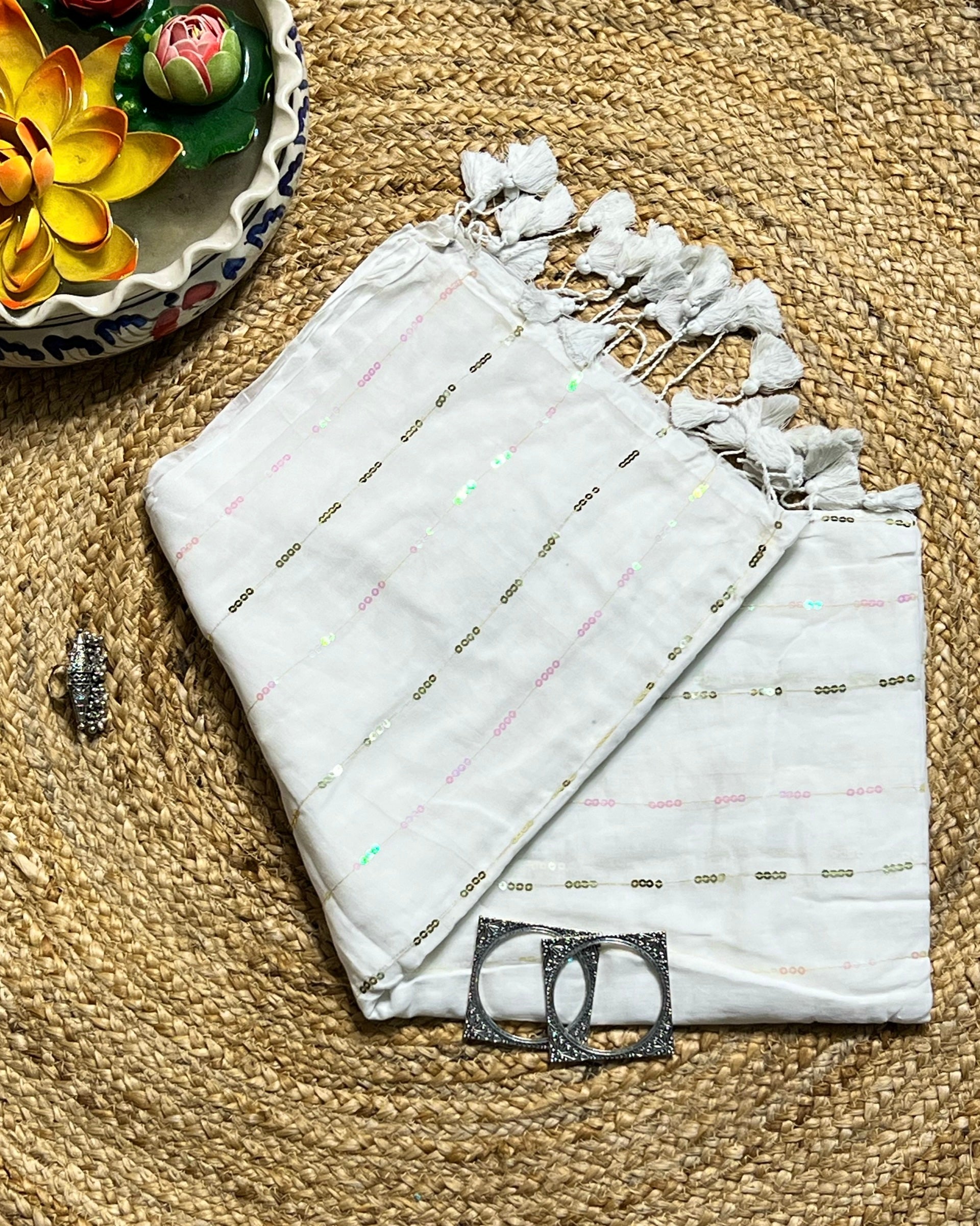 Designer white mulmul cotton saree with delicate sequins work for parties and celebrations