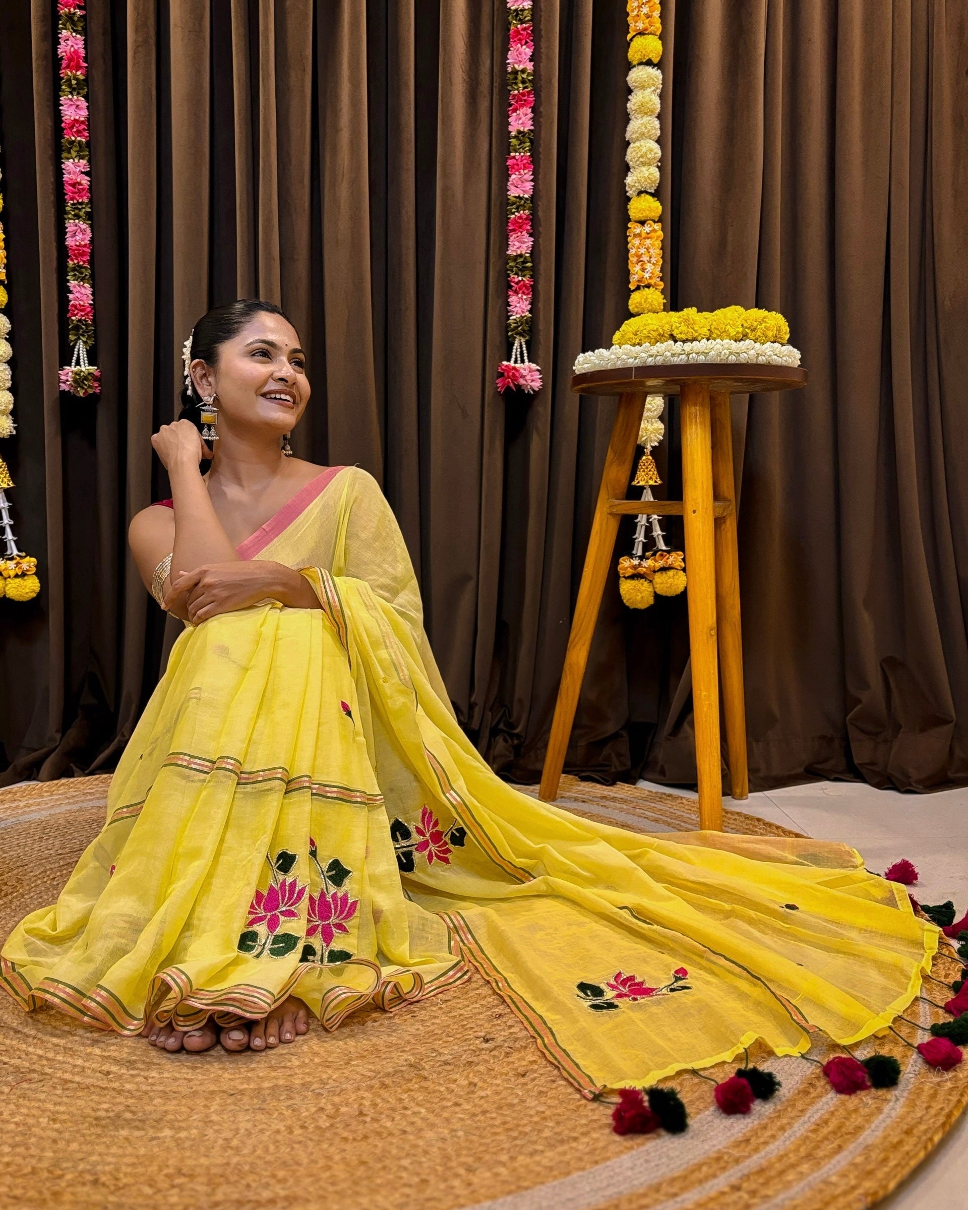 Elegant yellow mulmul saree with delicate handcrafted embroidery