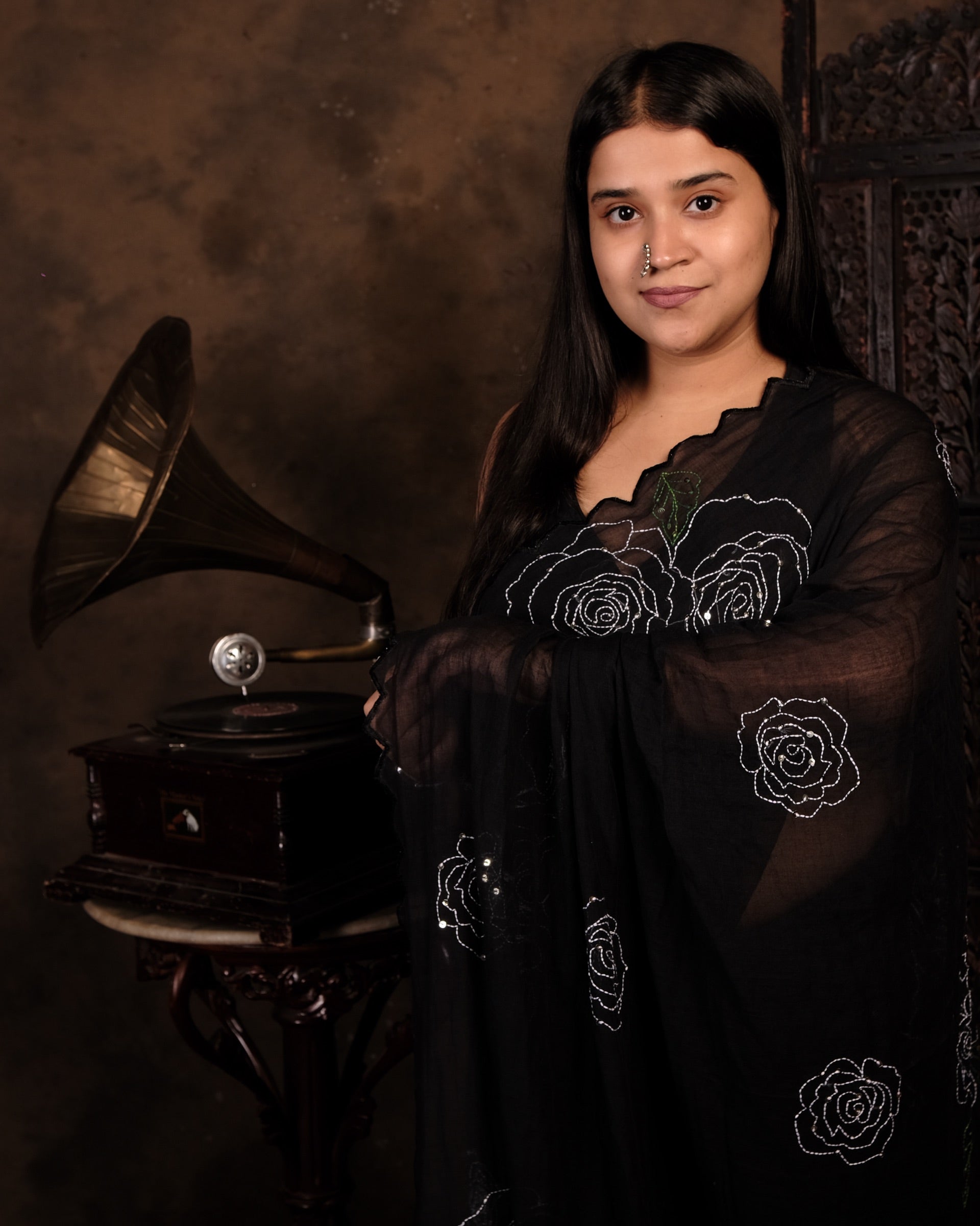Soft and comfortable light weight black mulmul cotton saree by Shopaame with rose embroidery sequins embellished, good for day time wear.