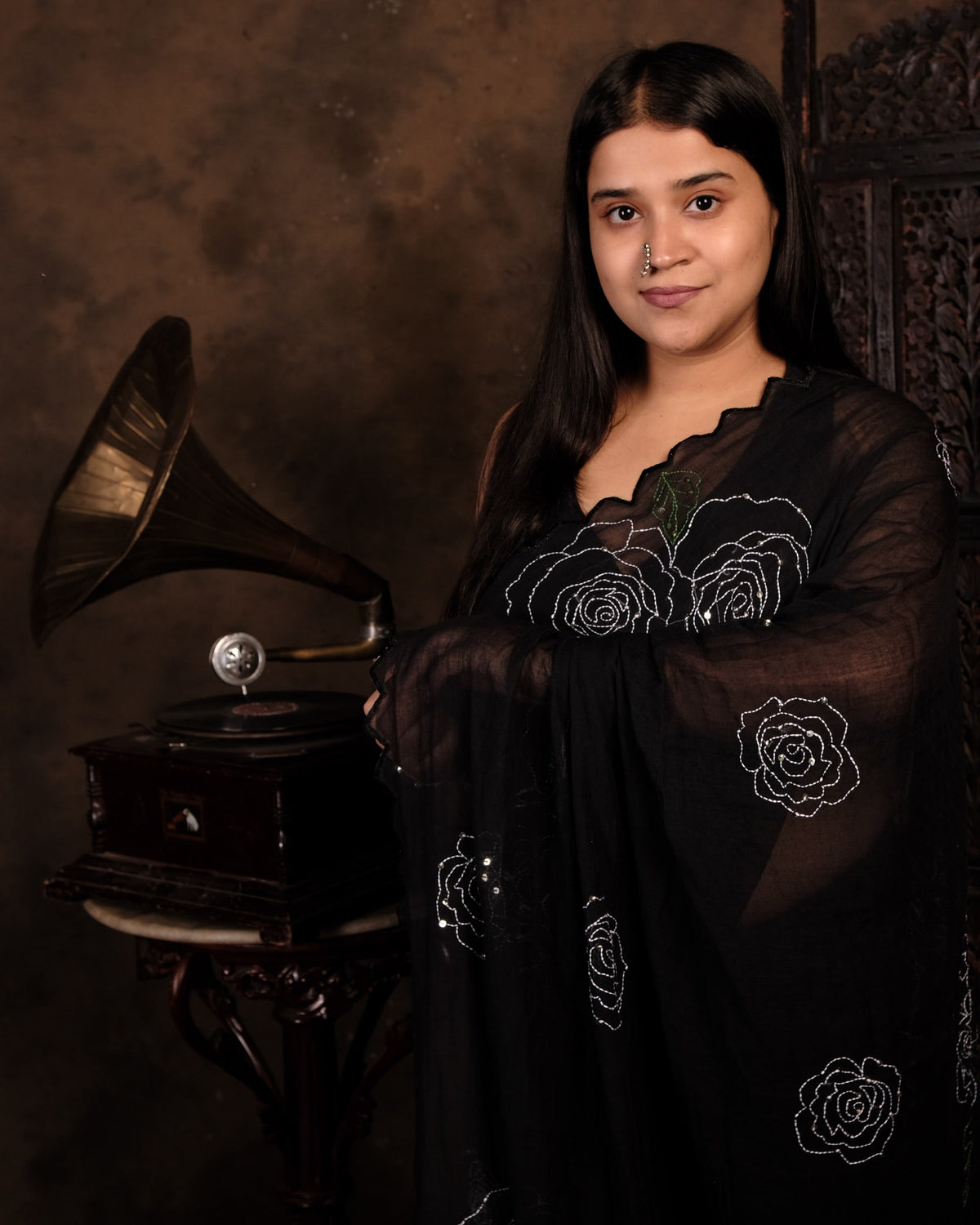 Soft and comfortable light weight black mulmul cotton saree by Shopaame with rose embroidery sequins embellished, good for day time wear.
