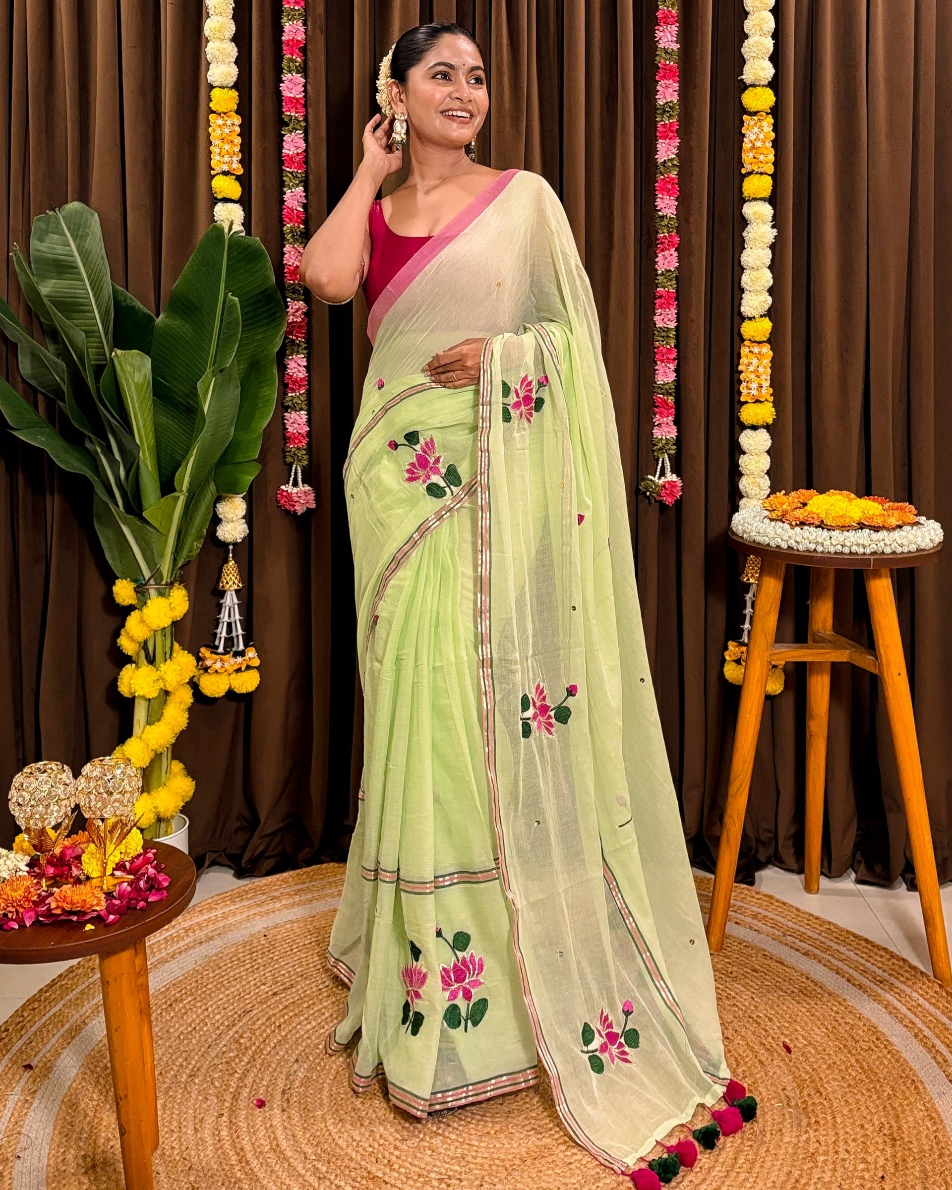 Hand embroidered green mulmul cotton saree with floral lotus design
