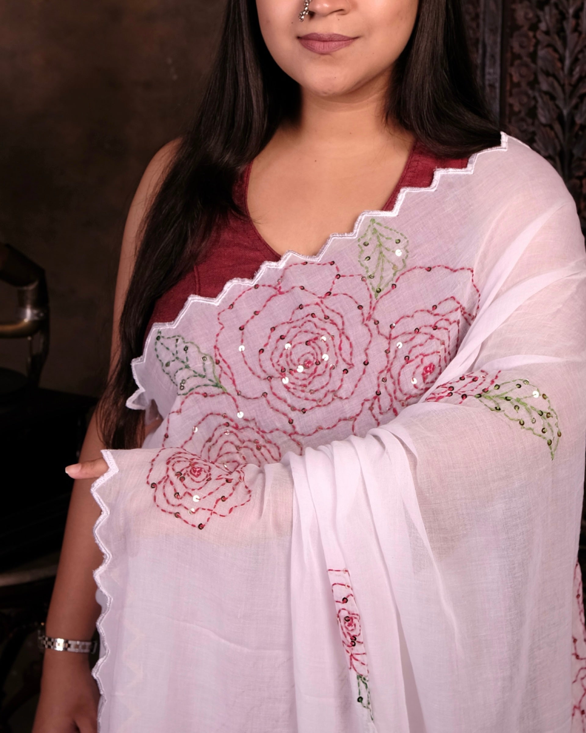 White cotton saree with delicate rose sequins work, a breathable festive saree perfect for summer comfort.