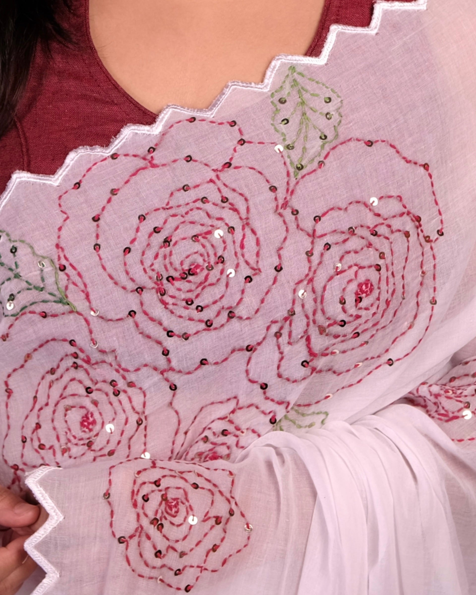 White mulmul cotton saree with rose detailing and sequins, a breathable saree for festive occasions and summer days.