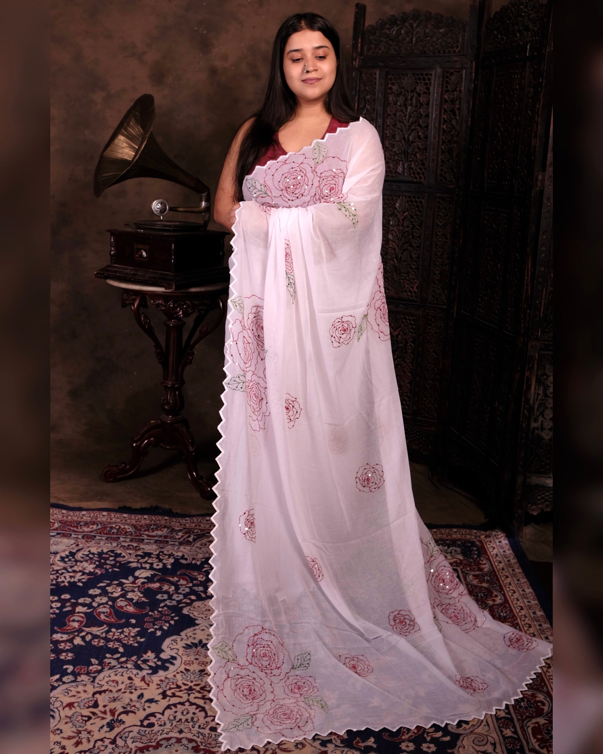 White mulmul cotton saree with rose sequins embroidery, soft airy elegance for festive moments and summer styling.