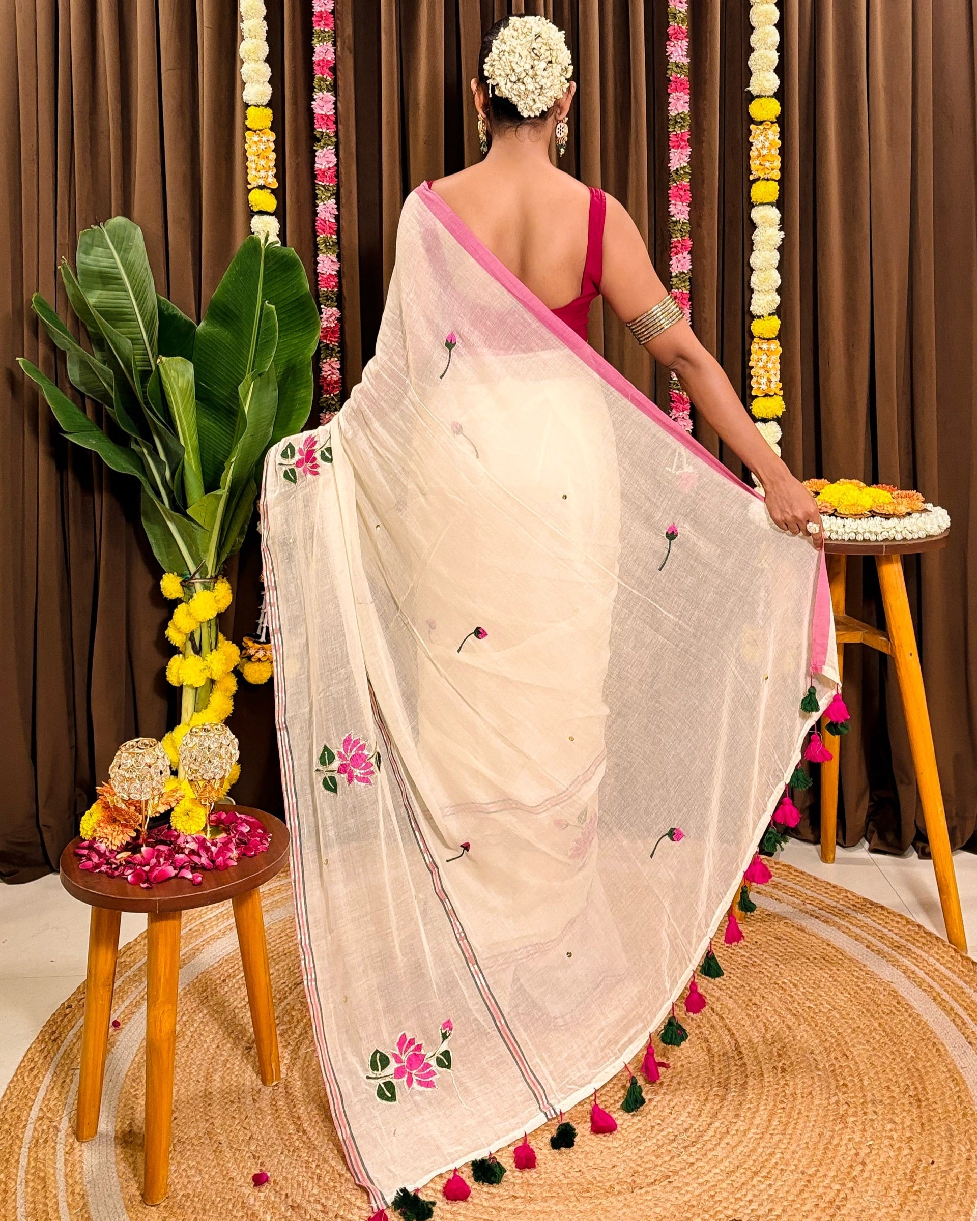 White mulmul cotton saree with hand embroidered lotus design