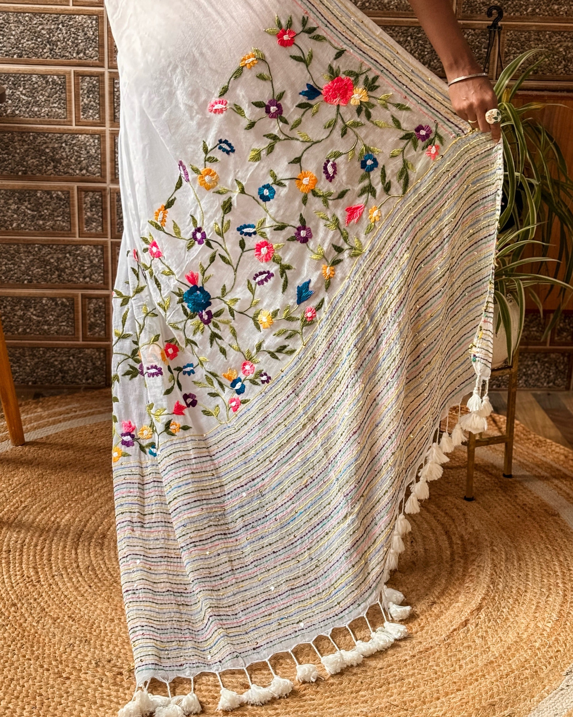 Model wearing Frosted Floral Muse white embroidered saree with subtle floral embroidery