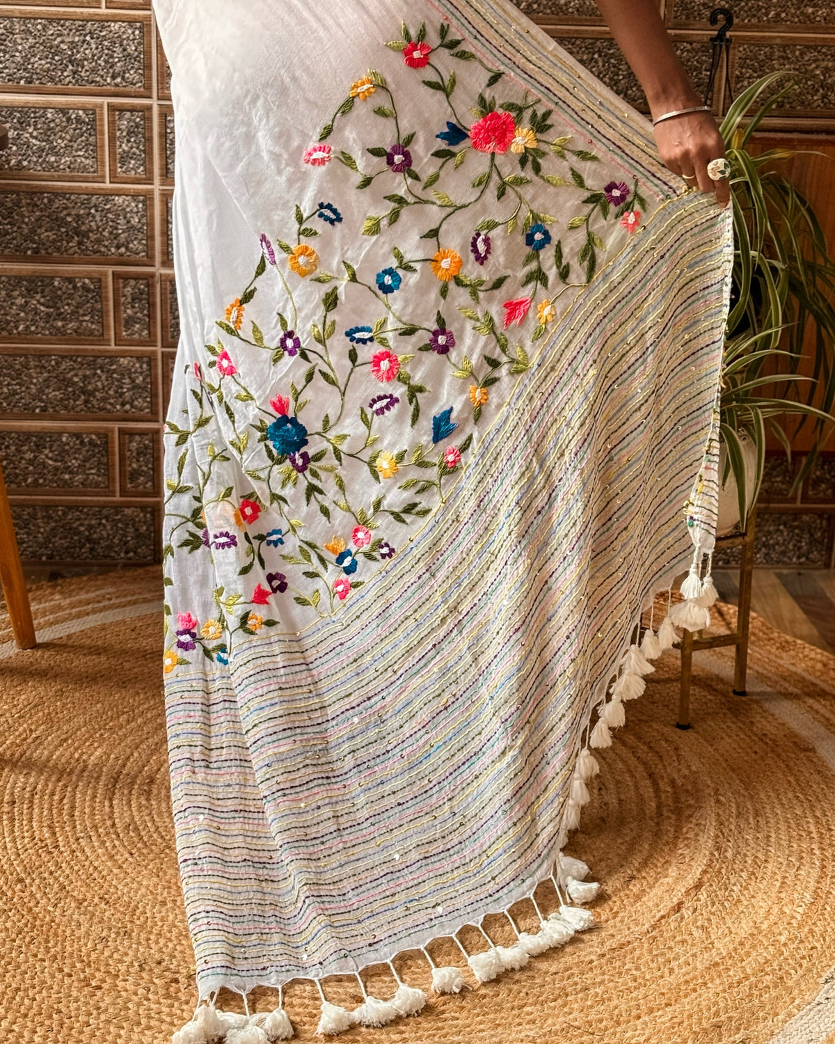 Model wearing Frosted Floral Muse white embroidered saree with subtle floral embroidery