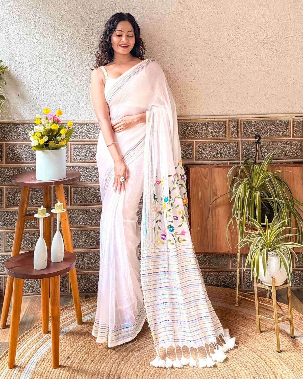 Handcrafted white saree featuring delicate floral embroidery from the Frosted Floral Muse collection